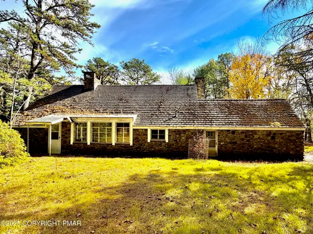 a view of a large pool with a yard