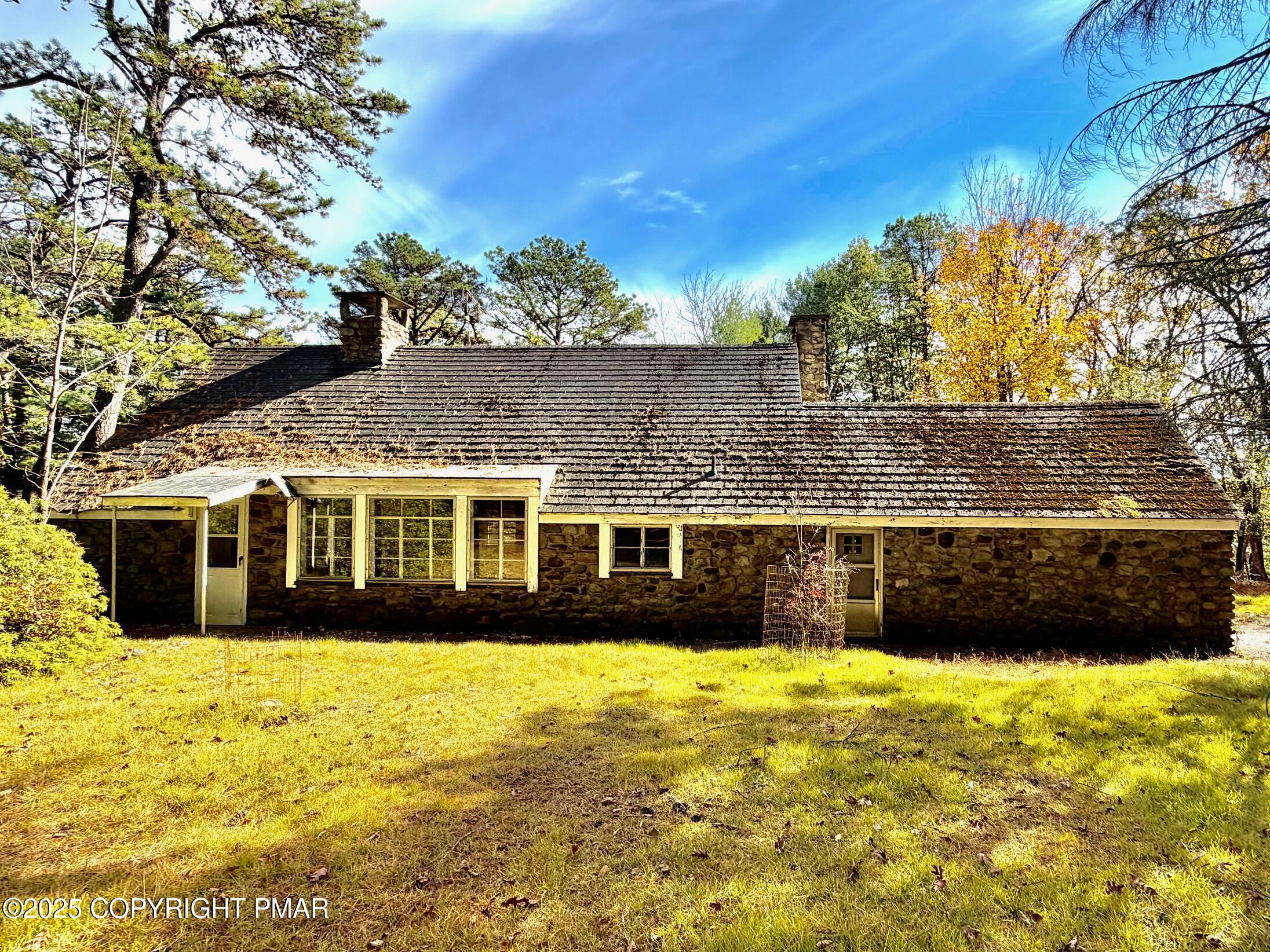 a view of a large pool with a yard