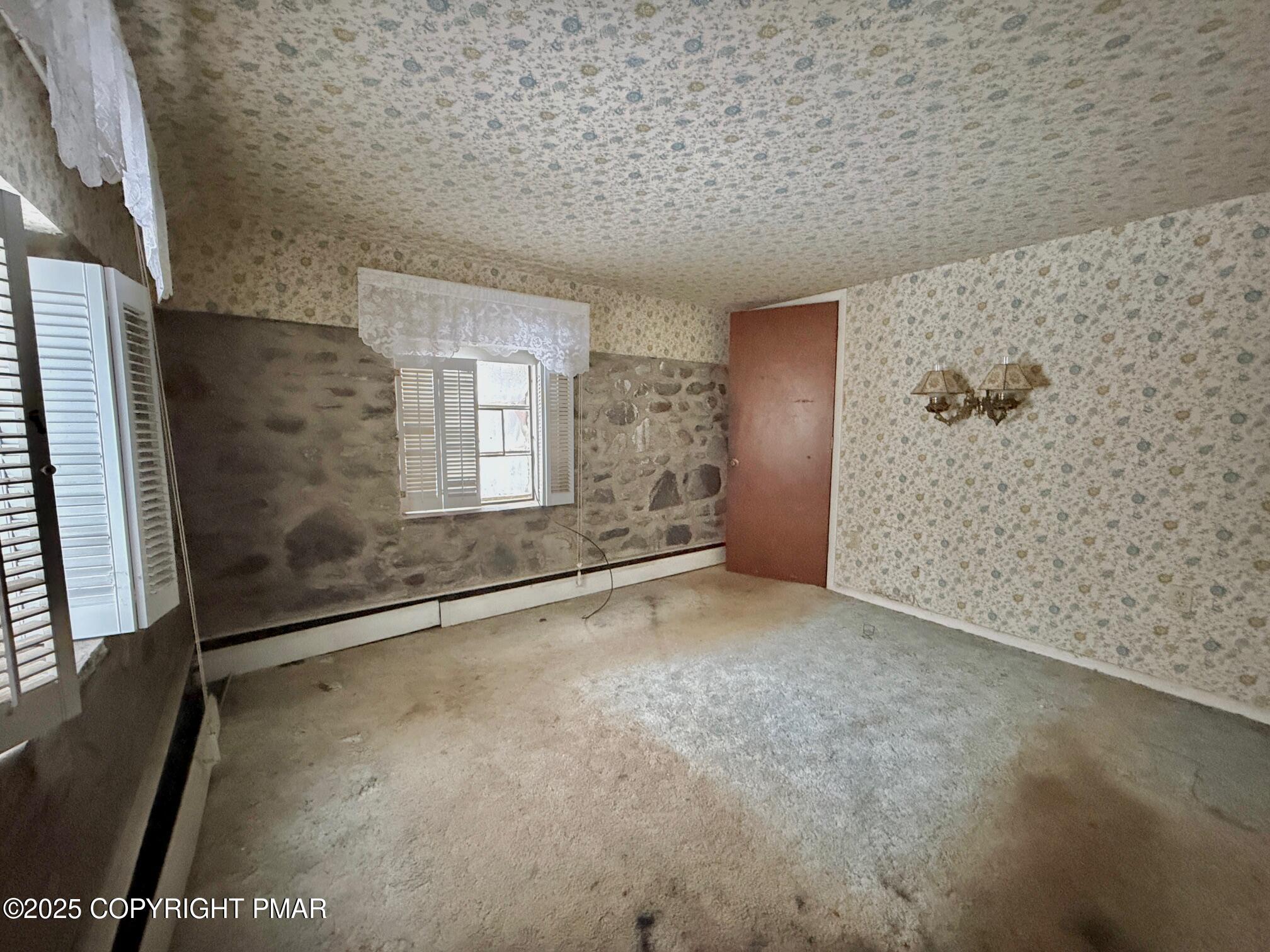 1734 Twin Pine Road Stroudsburg, PA 18360 - Photo 14 of 16 a view of an empty room with a window