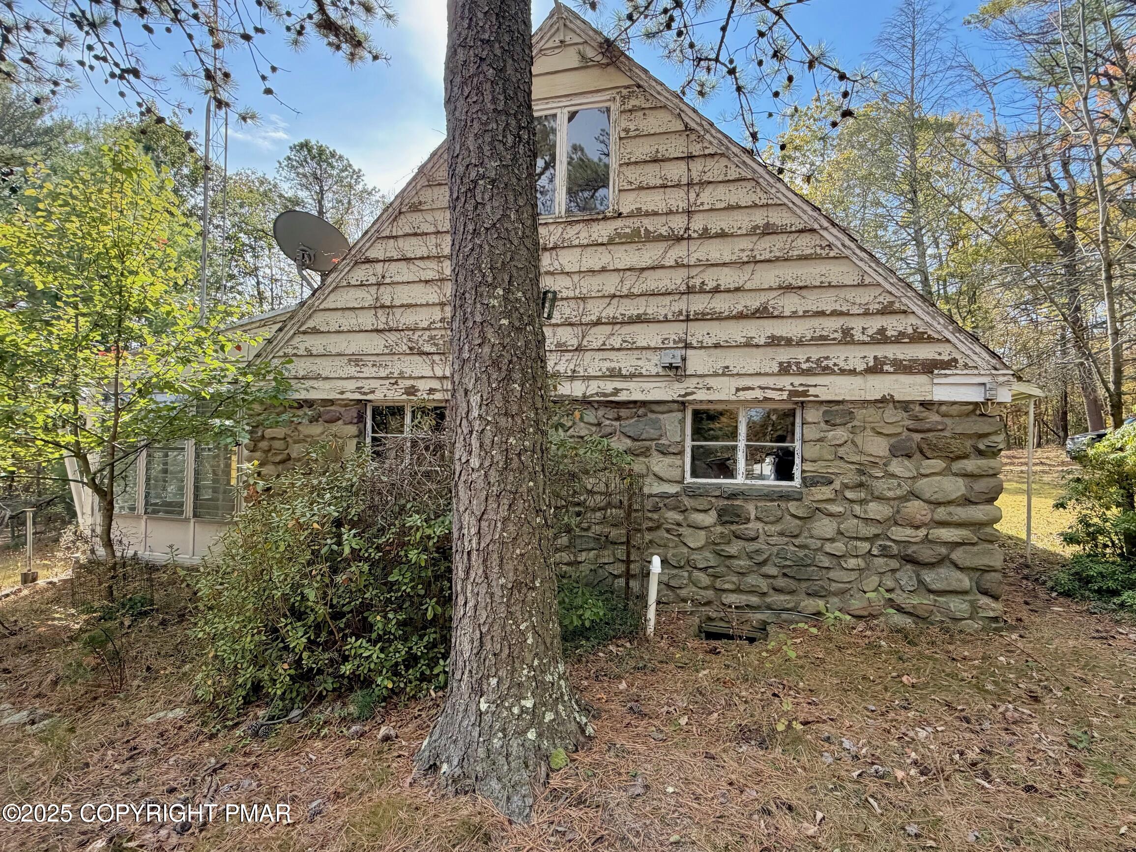 1734 Twin Pine Road Stroudsburg, PA 18360 - Photo 4 of 16 a view of a house with a yard