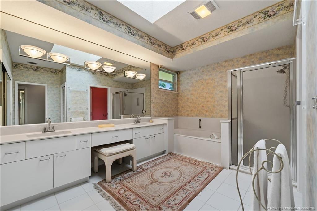 3510 Southeast Cambridge Drive Stuart, FL 34997 - Photo 18 of 38 Primary bath with skylight