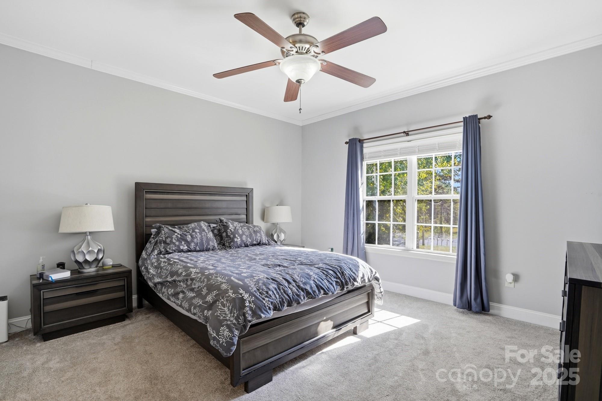 213 Carrie Road Oakboro, NC 28129 - Photo 13 of 40 a bedroom with a bed and a window