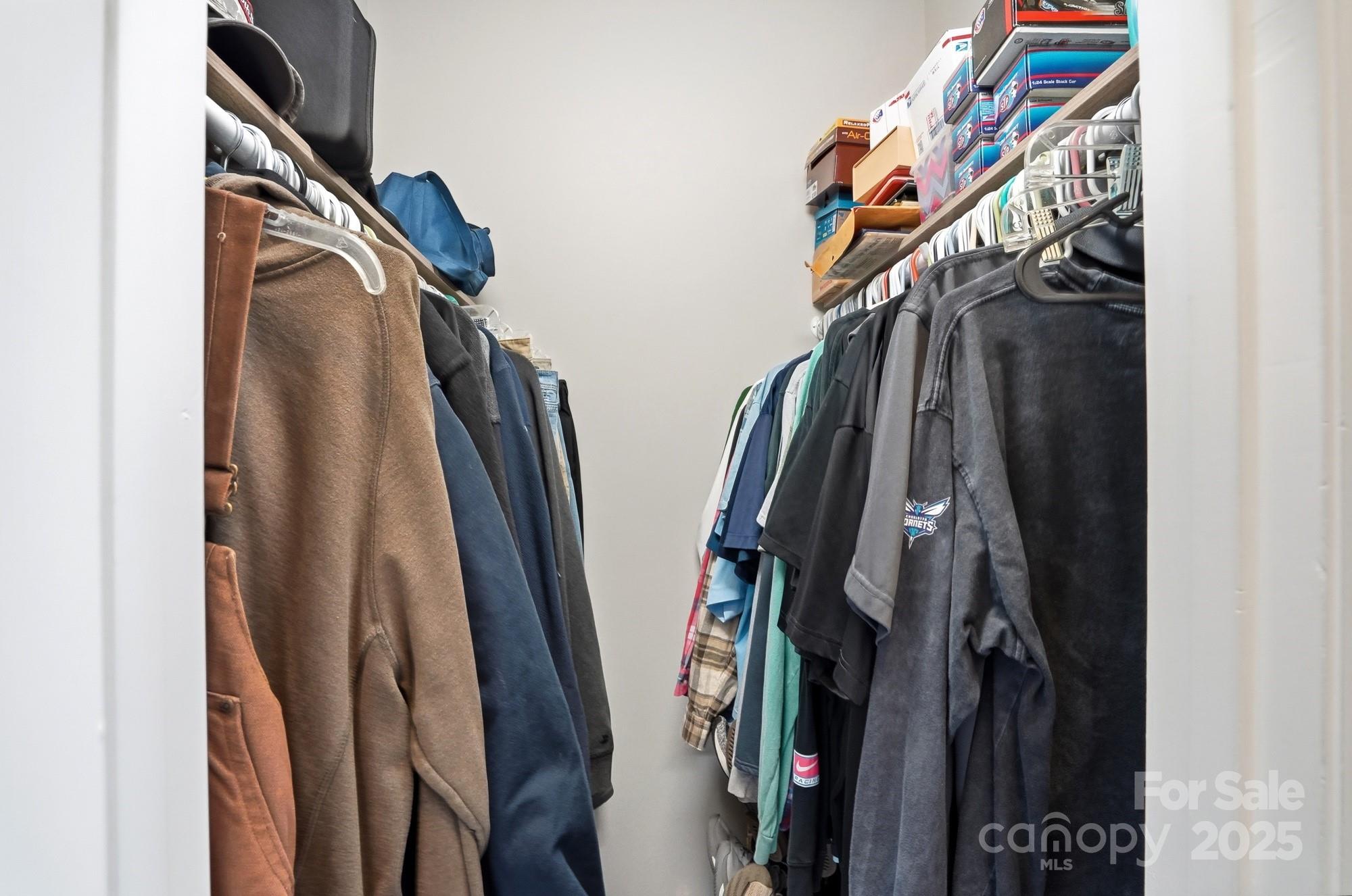 213 Carrie Road Oakboro, NC 28129 - Photo 19 of 40 a view of walk in closet with clothes