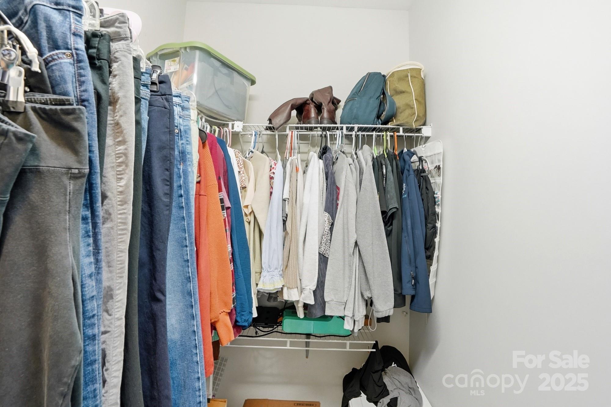 213 Carrie Road Oakboro, NC 28129 - Photo 20 of 40 a view of walk in closet with clothes