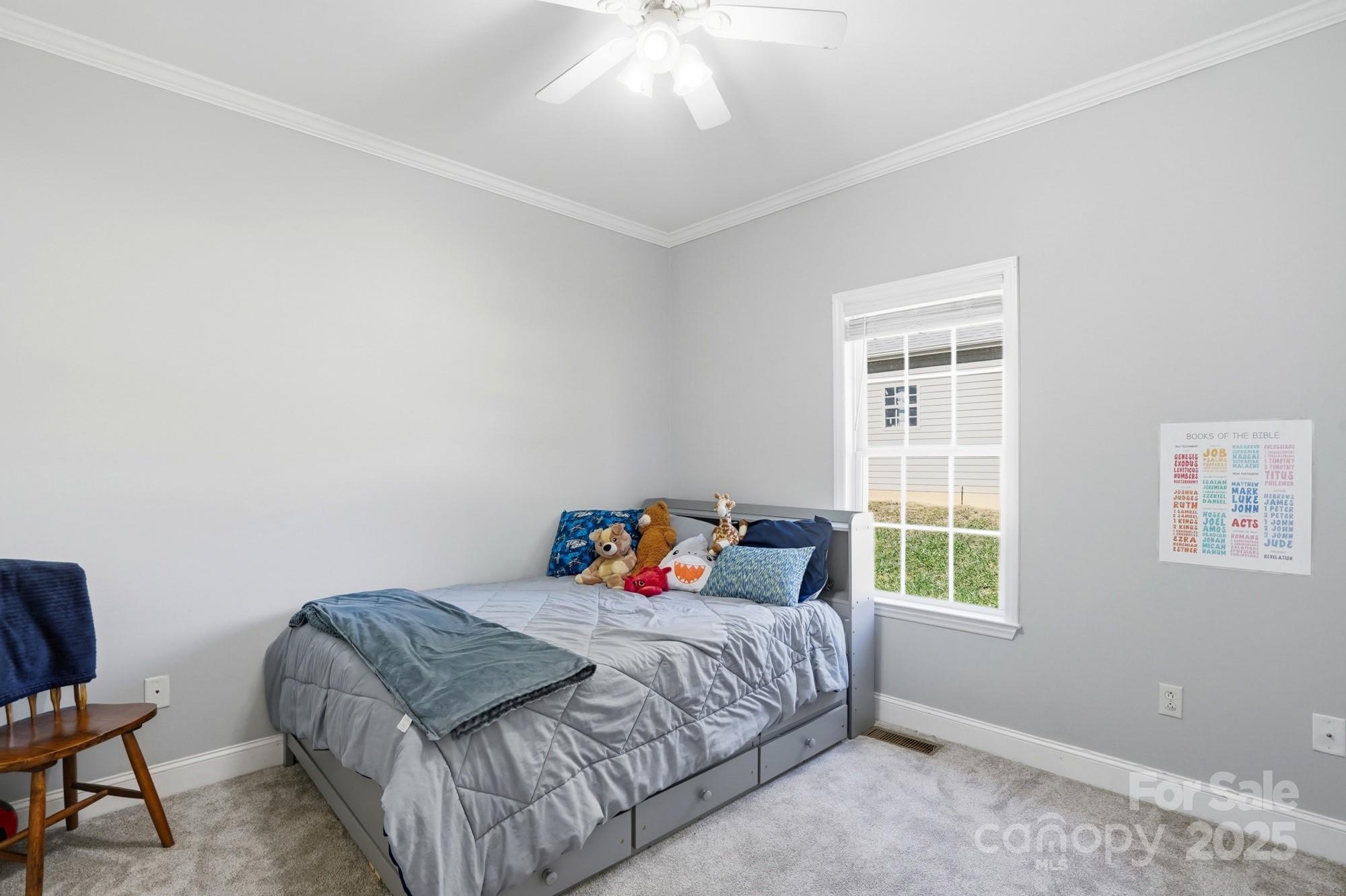 213 Carrie Road Oakboro, NC 28129 - Photo 21 of 40 a bedroom with a bed and window