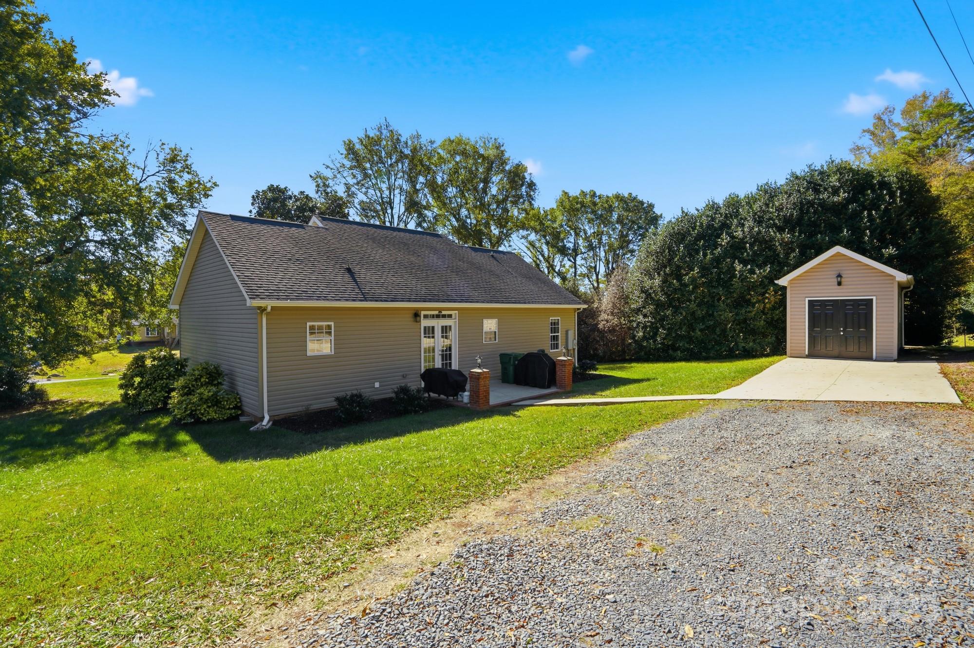 213 Carrie Road Oakboro, NC 28129 - Photo 30 of 40 a house view with a garden space