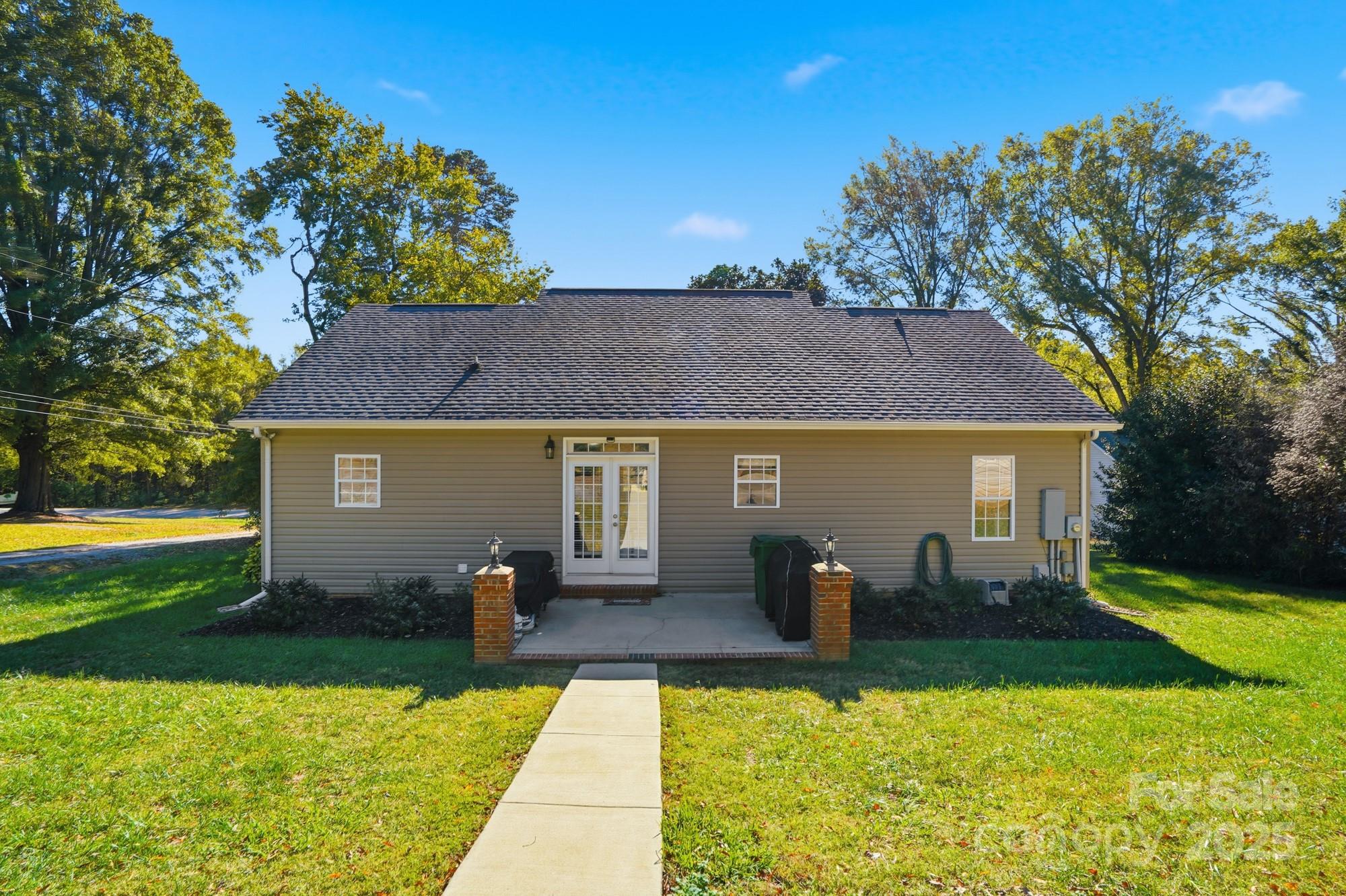 213 Carrie Road Oakboro, NC 28129 - Photo 31 of 40 a view of a house with pool and chairs