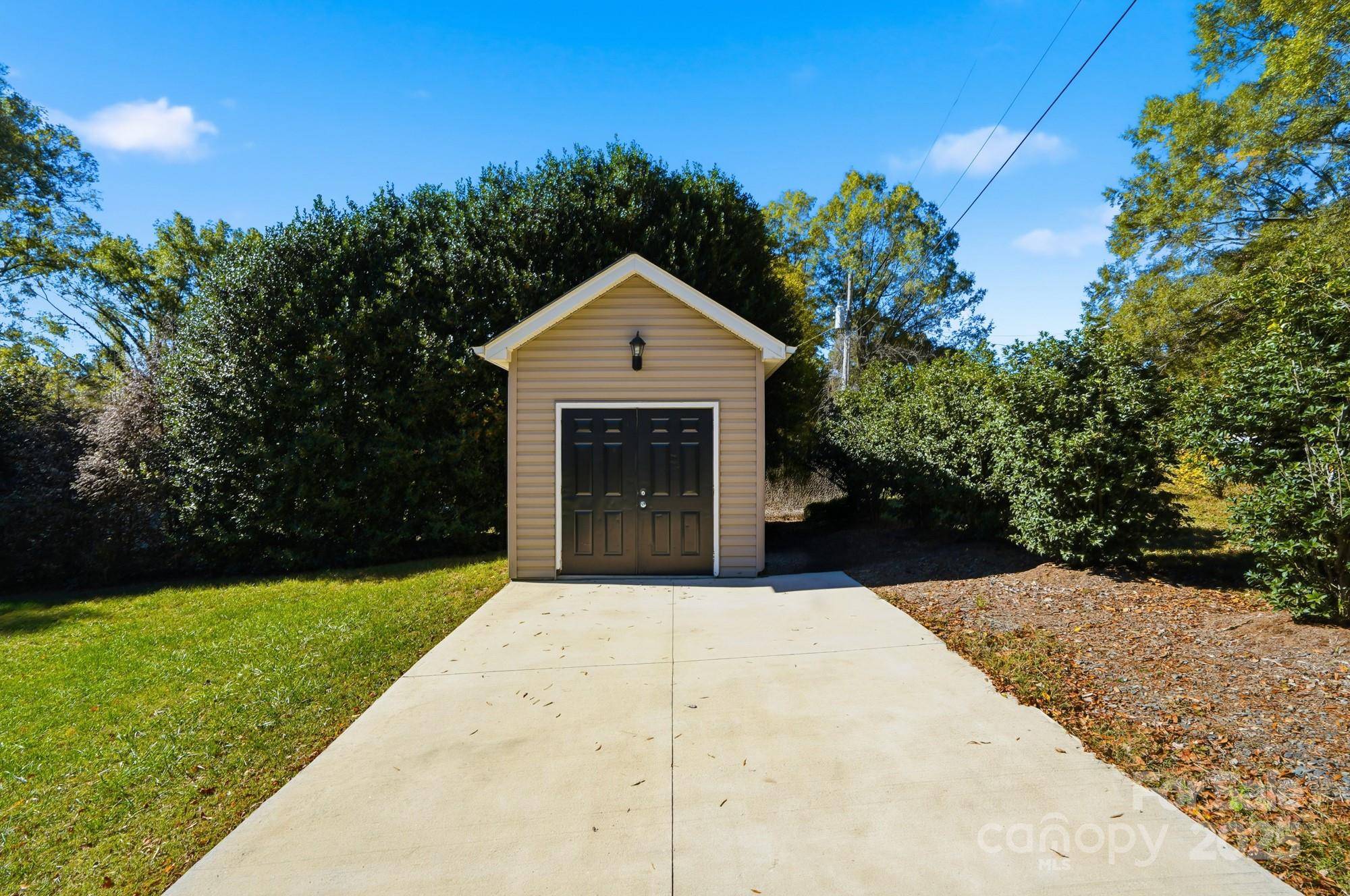 213 Carrie Road Oakboro, NC 28129 - Photo 32 of 40 a front view of a house with a yard and garage