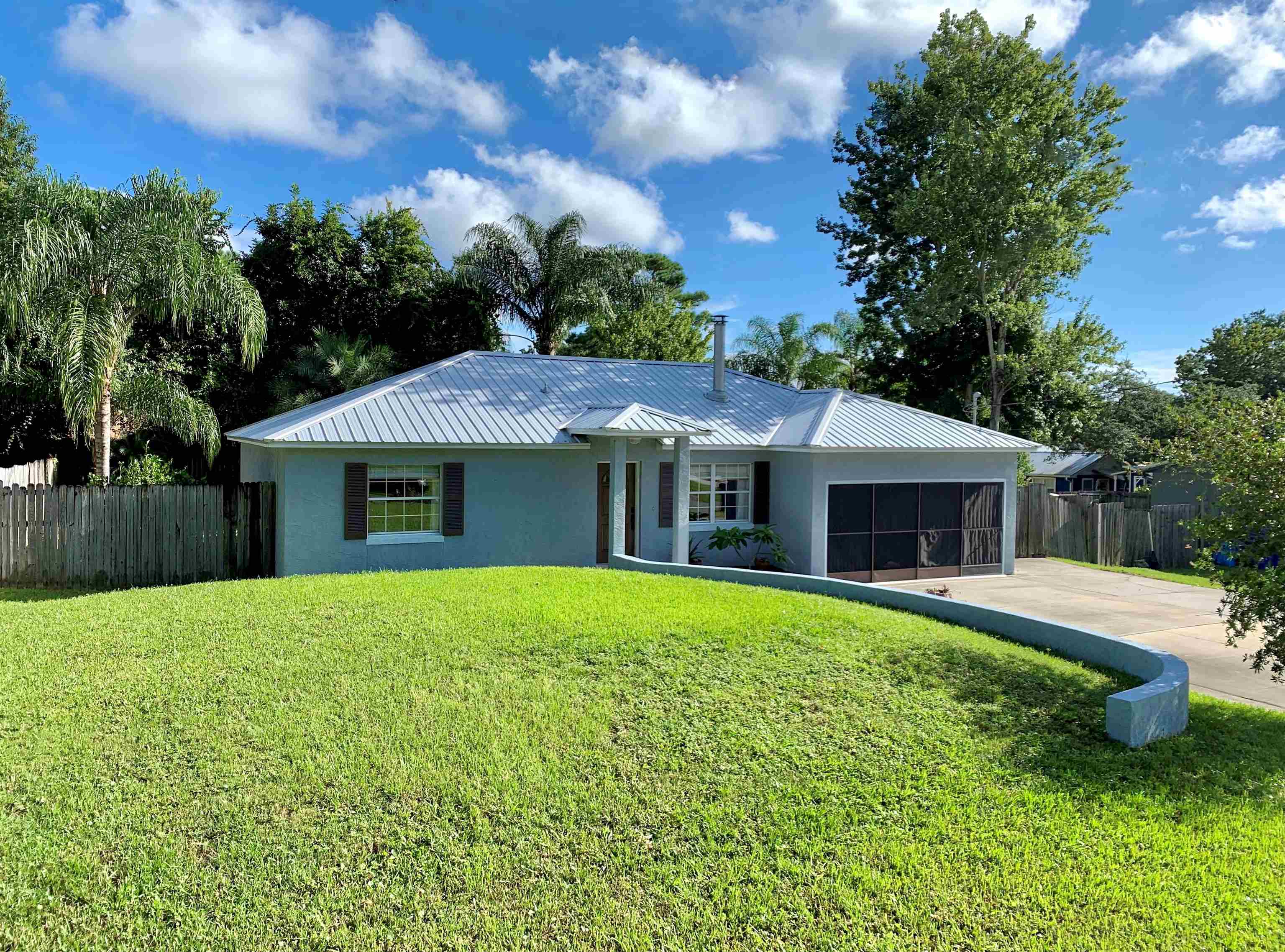 215 Yale Road St. Augustine, FL 32086 - Photo 1 of 35 a front view of house with yard and green space