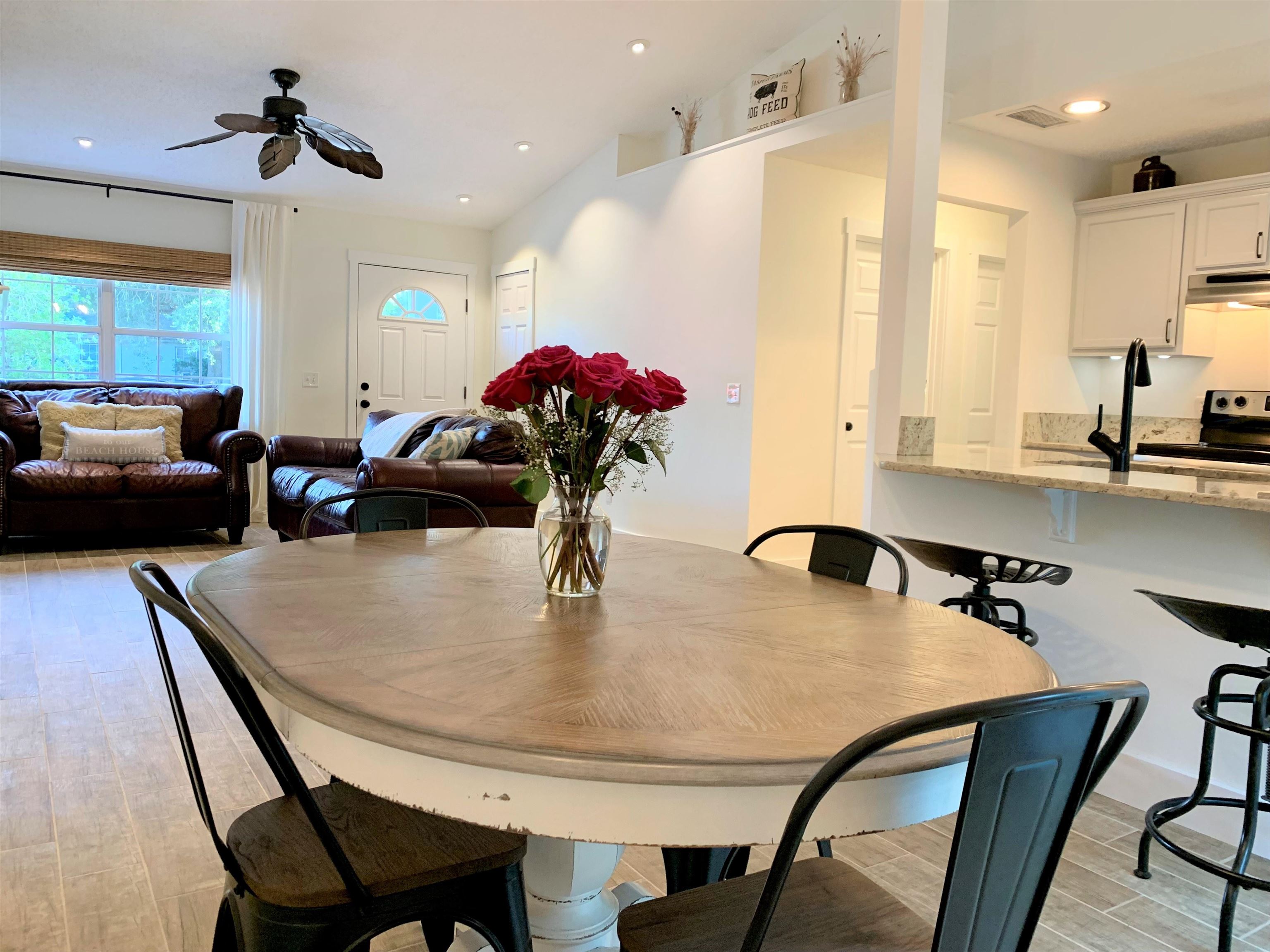 215 Yale Road St. Augustine, FL 32086 - Photo 11 of 35 a dining room with furniture and a chandelier