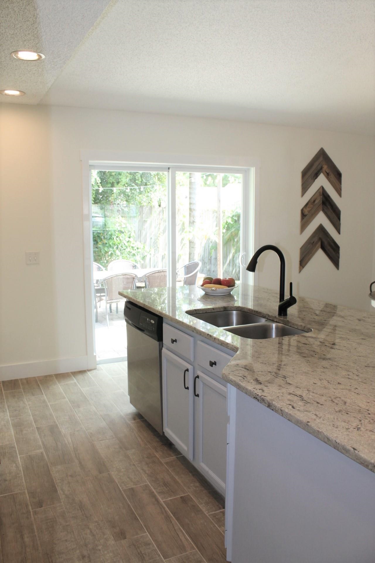 215 Yale Road St. Augustine, FL 32086 - Photo 16 of 35 a kitchen with a sink and a large window
