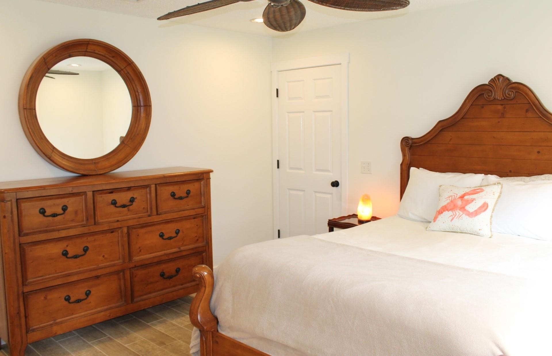 215 Yale Road St. Augustine, FL 32086 - Photo 18 of 35 a bedroom with a bed and a dresser