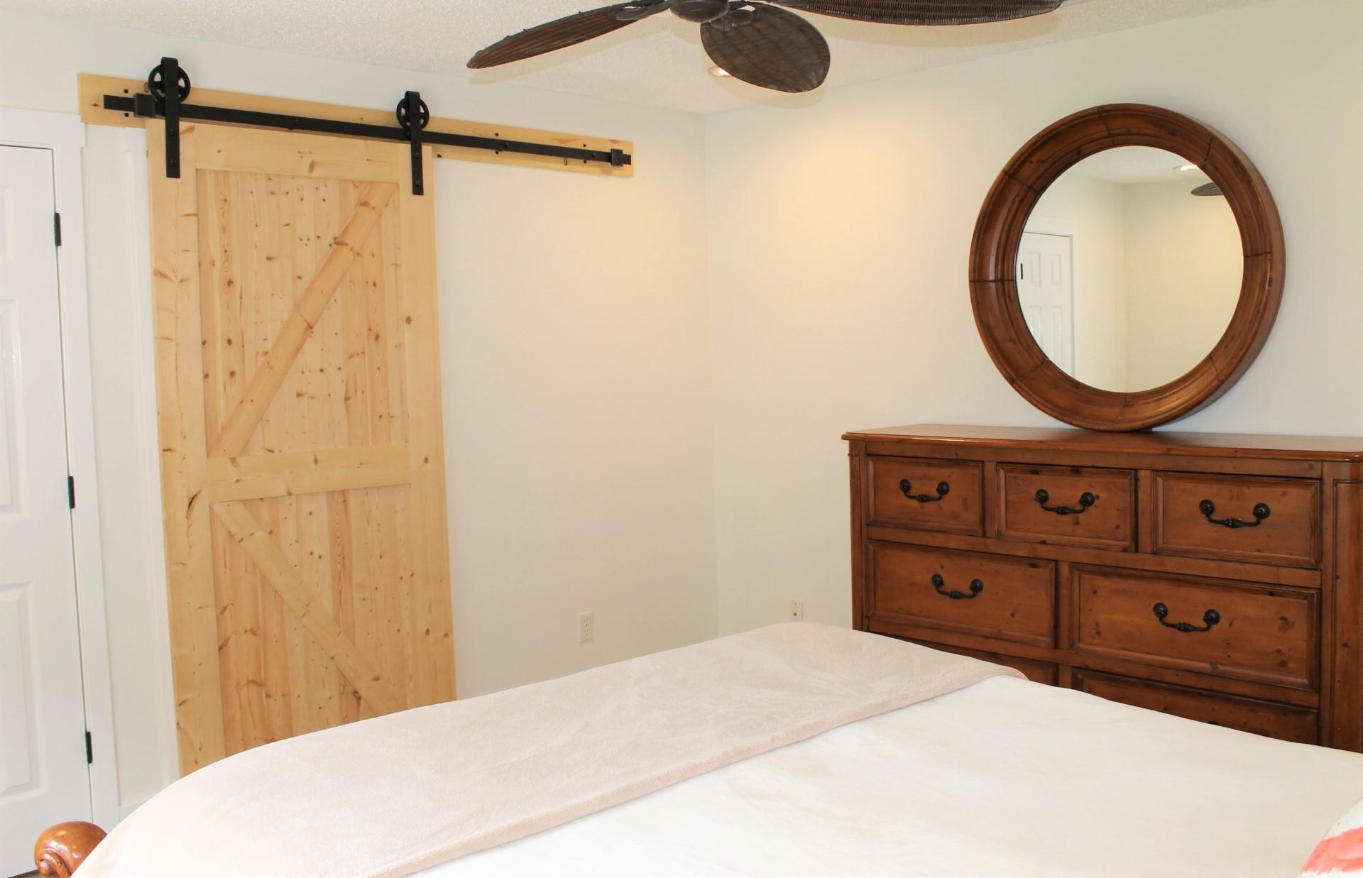 215 Yale Road St. Augustine, FL 32086 - Photo 19 of 35 a bedroom with a bed and a dresser