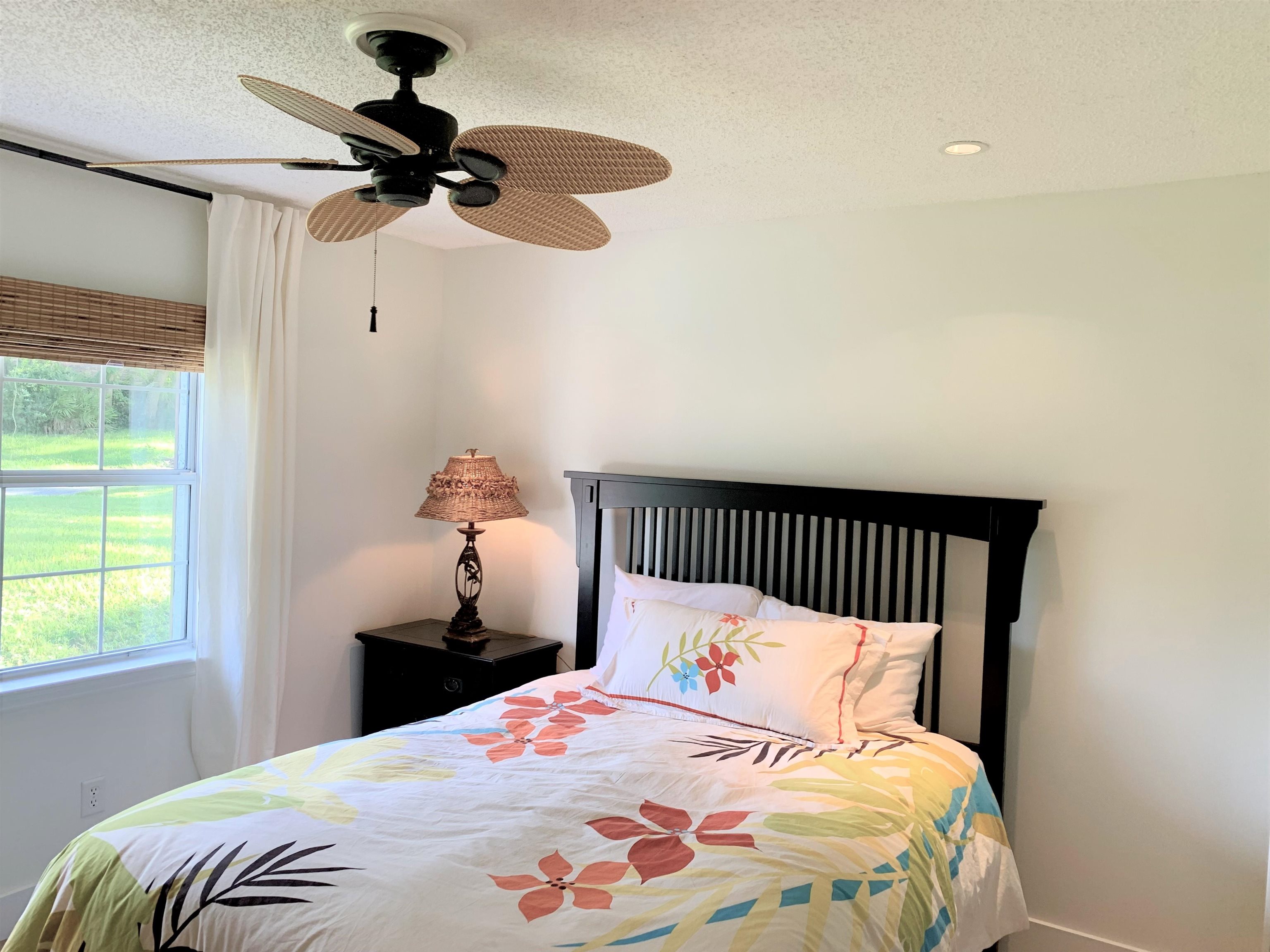 215 Yale Road St. Augustine, FL 32086 - Photo 24 of 35 a bedroom with a bed and a window