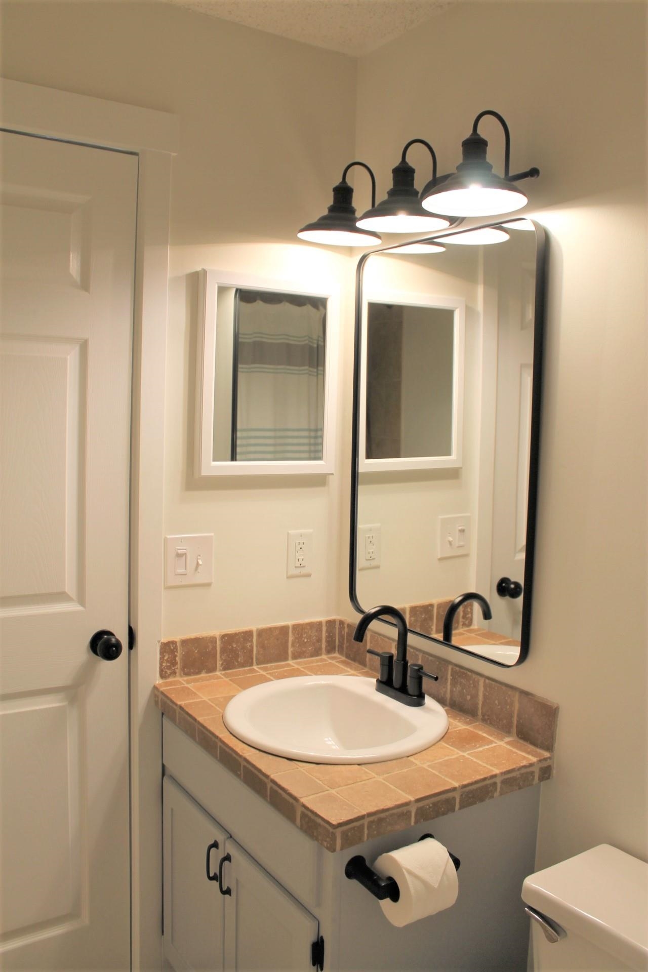 215 Yale Road St. Augustine, FL 32086 - Photo 29 of 35 a bathroom with a sink and a mirror