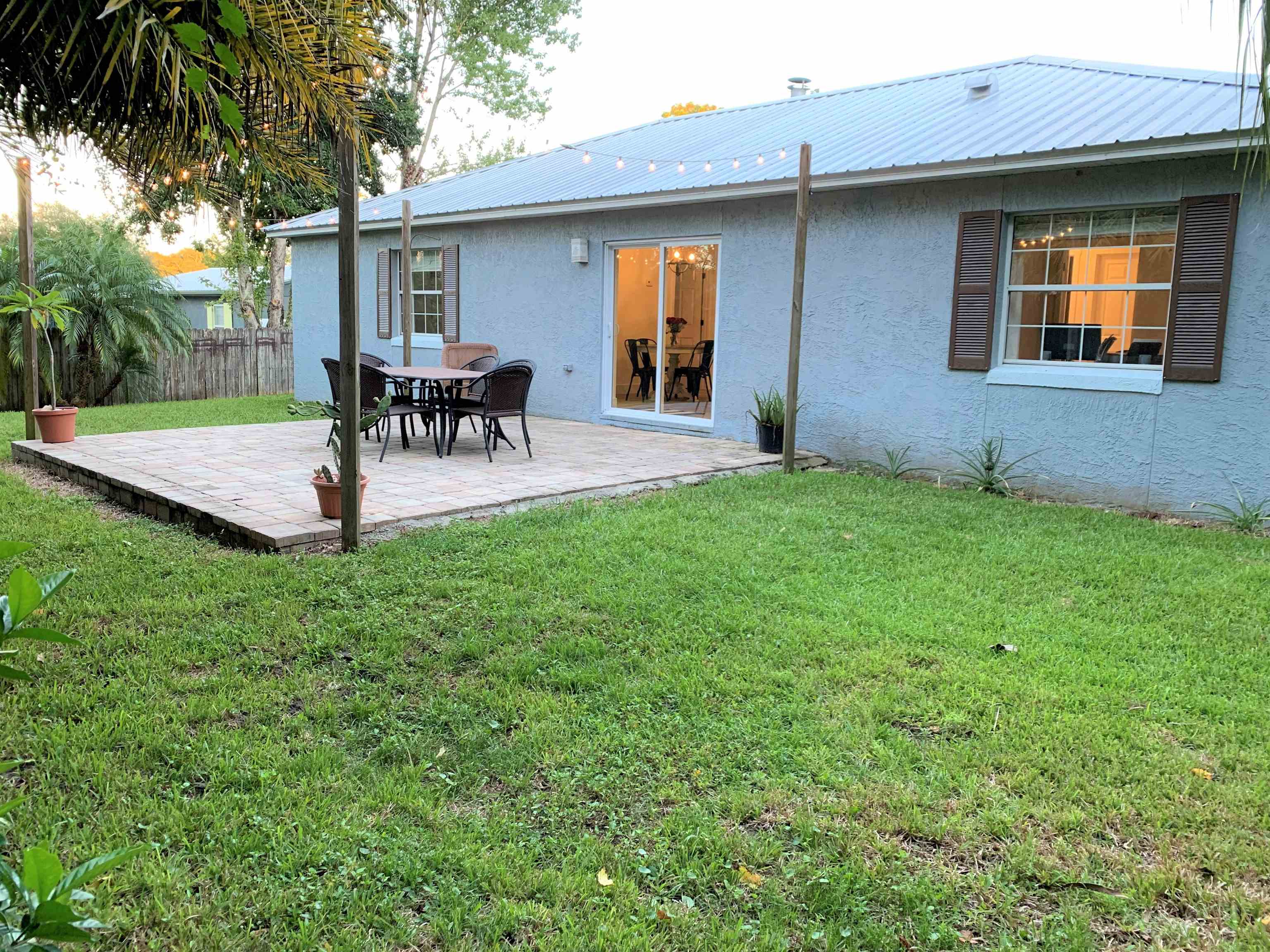 215 Yale Road St. Augustine, FL 32086 - Photo 34 of 35 a view of a house with a backyard and a patio