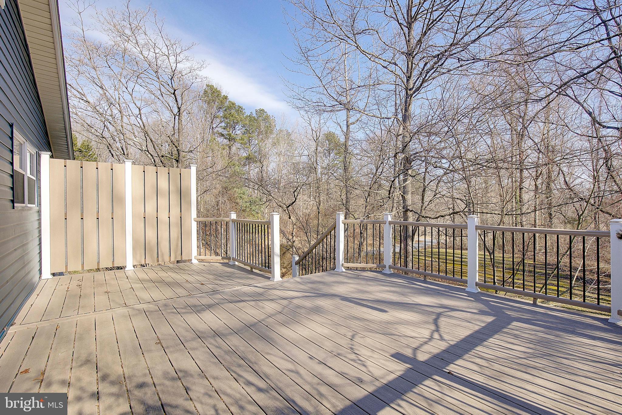 1225 Lake Ridge Drive Sunderland, MD 20689 - Photo 12 of 57 a view of a house with a wooden fence