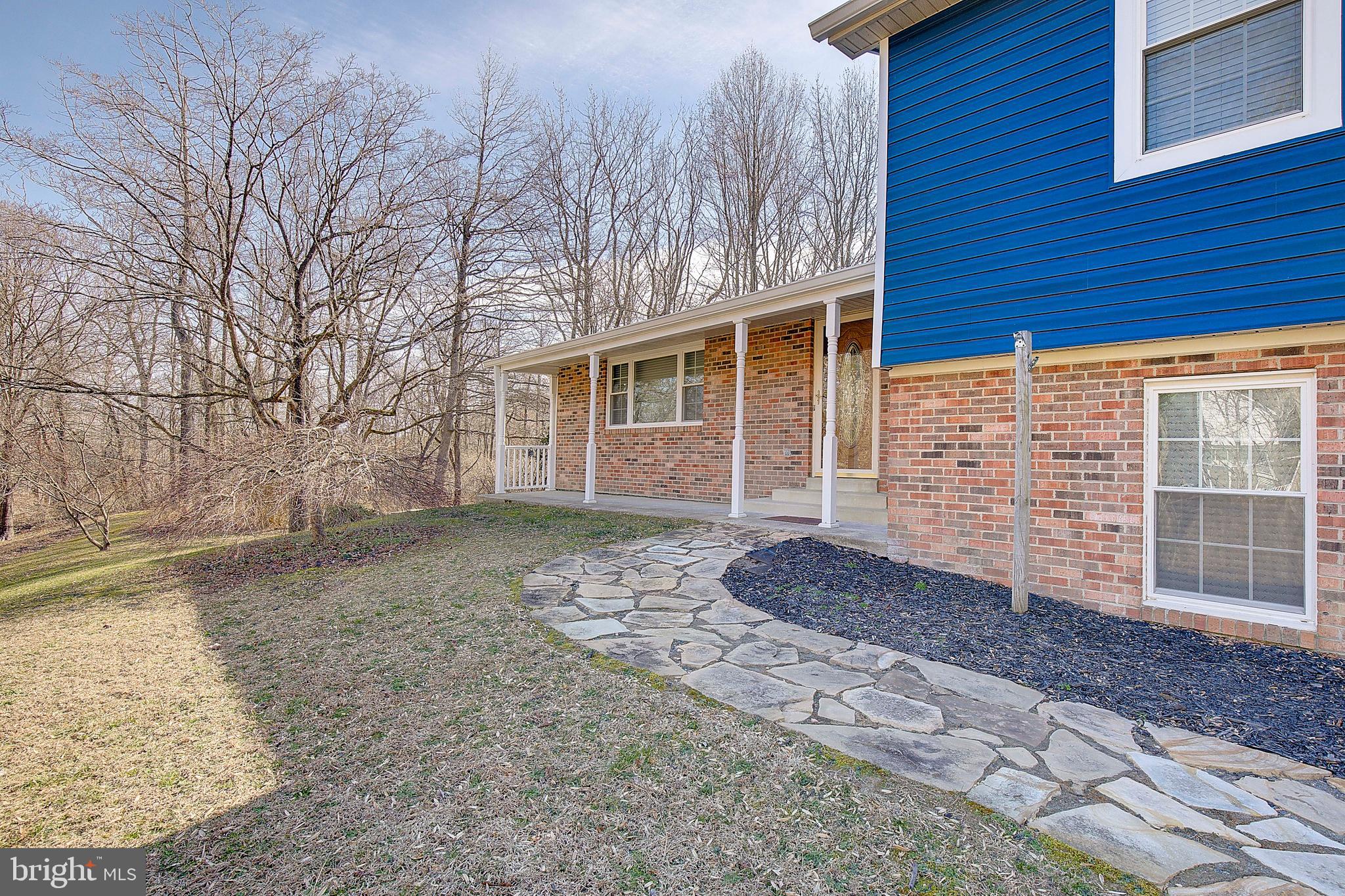 1225 Lake Ridge Drive Sunderland, MD 20689 - Photo 3 of 57 a front view of a house with a yard