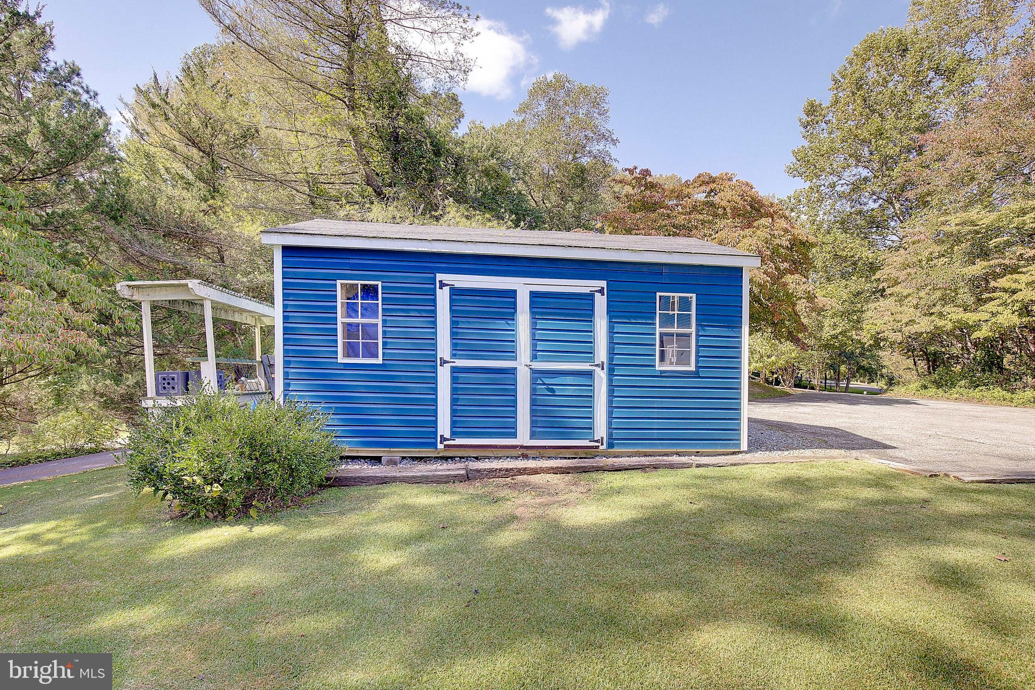 1225 Lake Ridge Drive Sunderland, MD 20689 - Photo 34 of 57 a view of a backyard with brick wall and plants