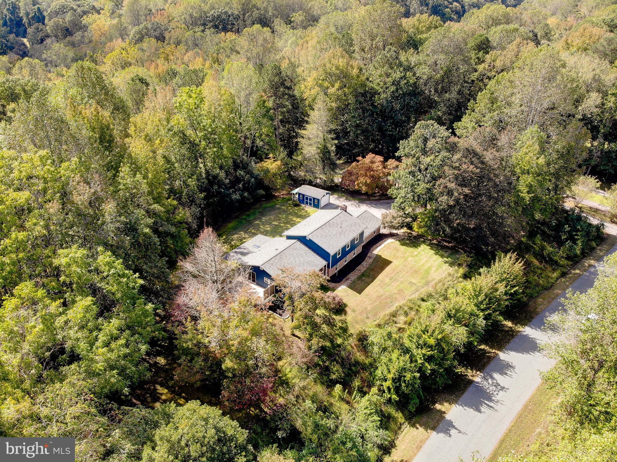 1225 Lake Ridge Drive Sunderland, MD 20689 - Photo 40 of 57 a view of a house with a yard and covered with swimming pool
