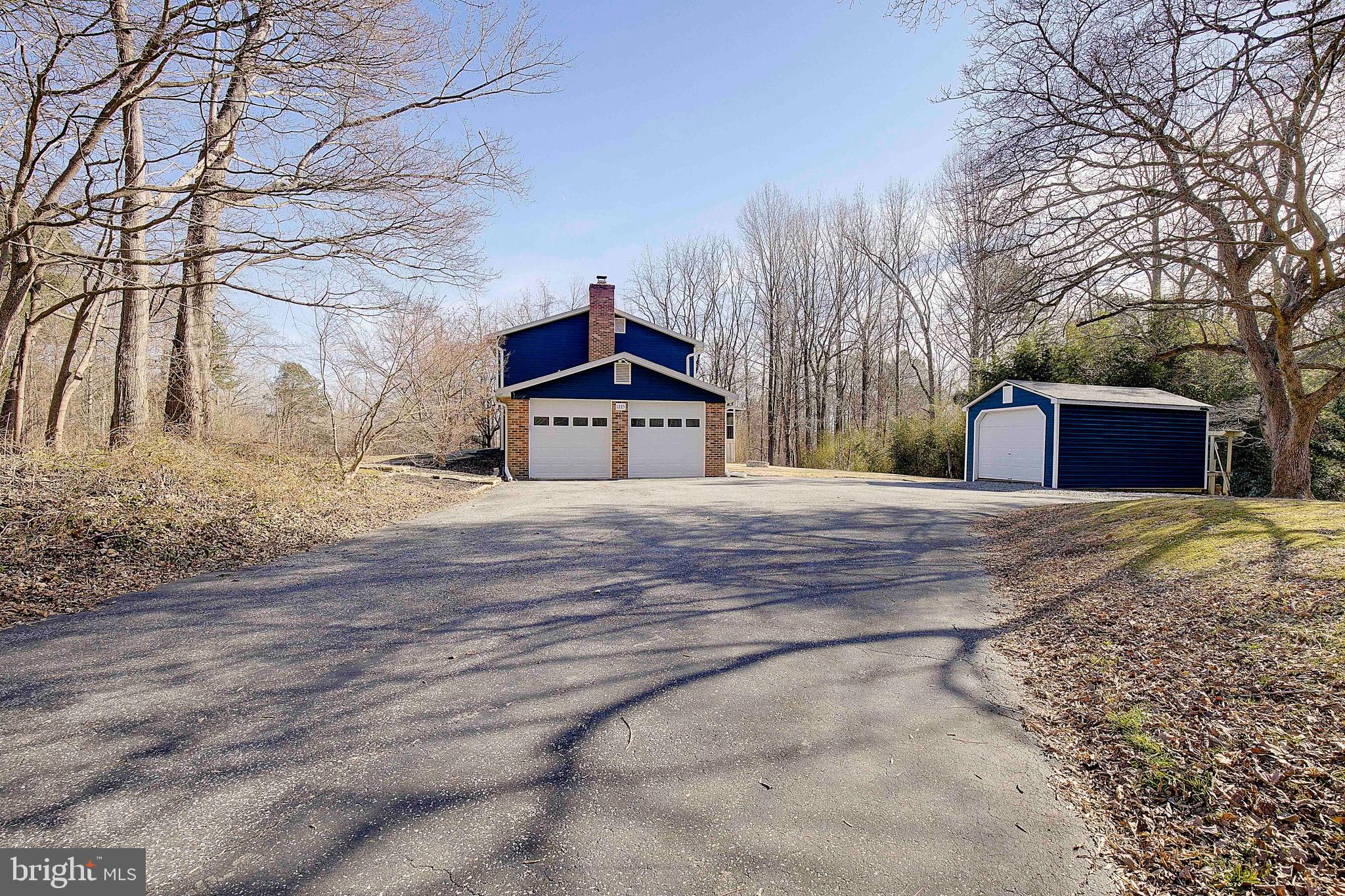 1225 Lake Ridge Drive Sunderland, MD 20689 - Photo 4 of 57 a front view of a house with a yard covered with snow