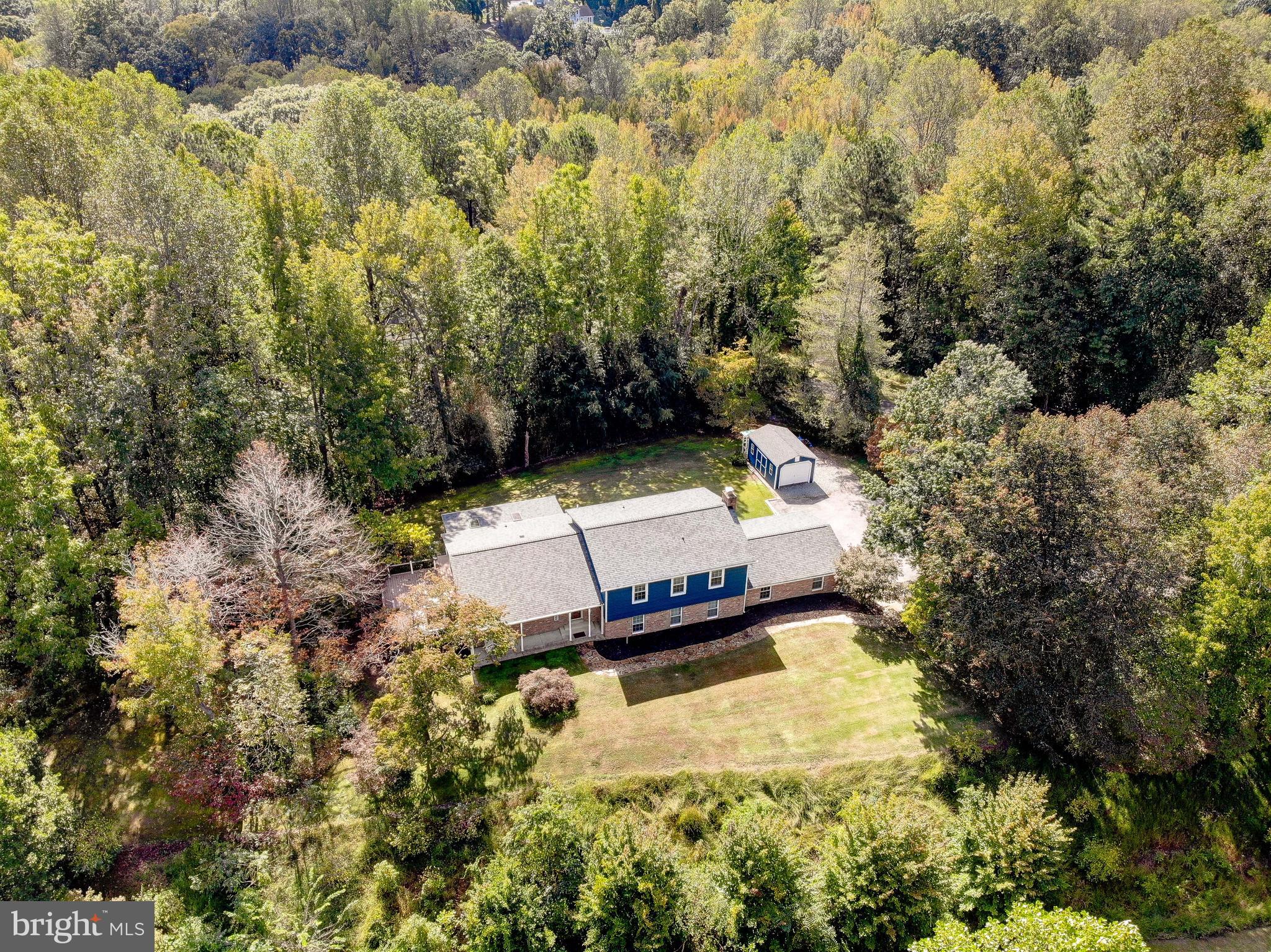 1225 Lake Ridge Drive Sunderland, MD 20689 - Photo 41 of 57 a view of a house with a yard and large trees