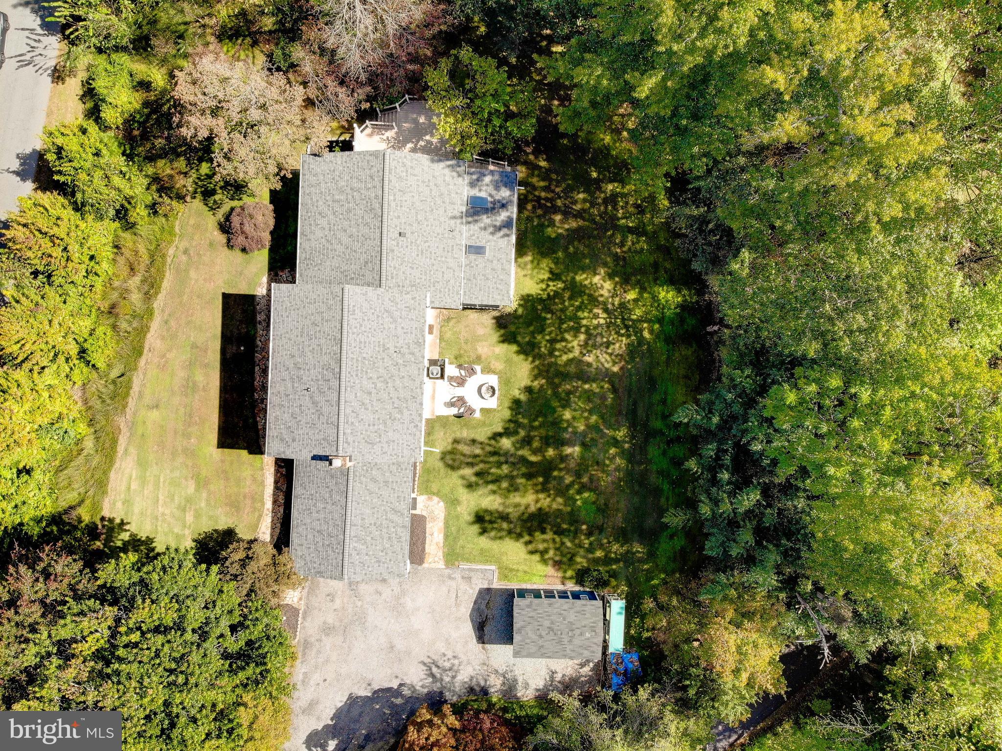 1225 Lake Ridge Drive Sunderland, MD 20689 - Photo 43 of 57 an aerial view of a house with trees all around