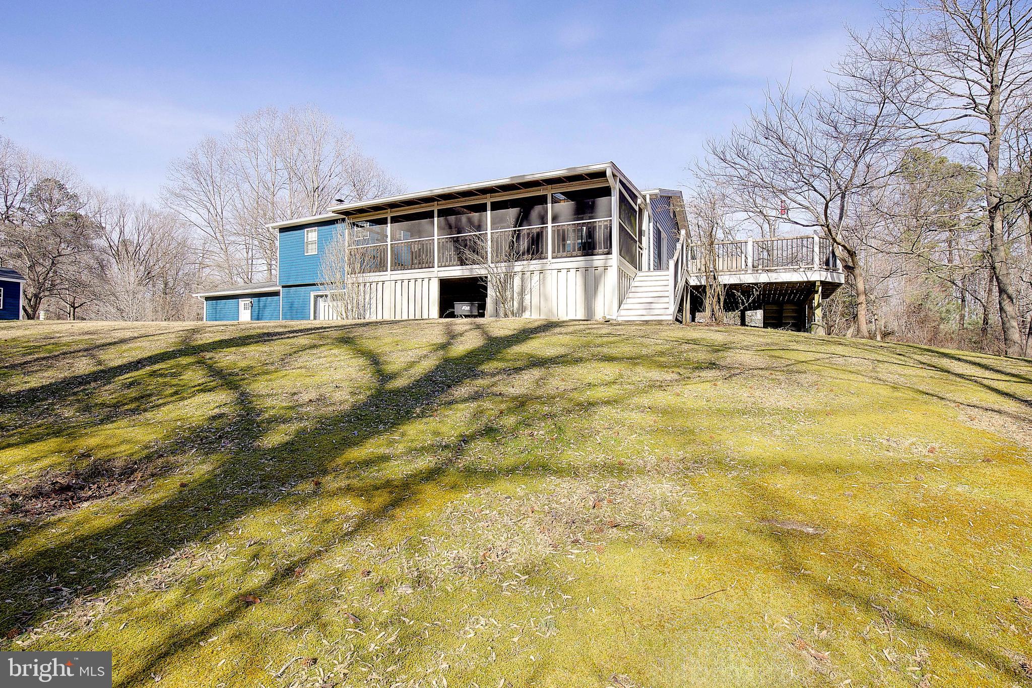 1225 Lake Ridge Drive Sunderland, MD 20689 - Photo 7 of 57 a front view of a house with a yard