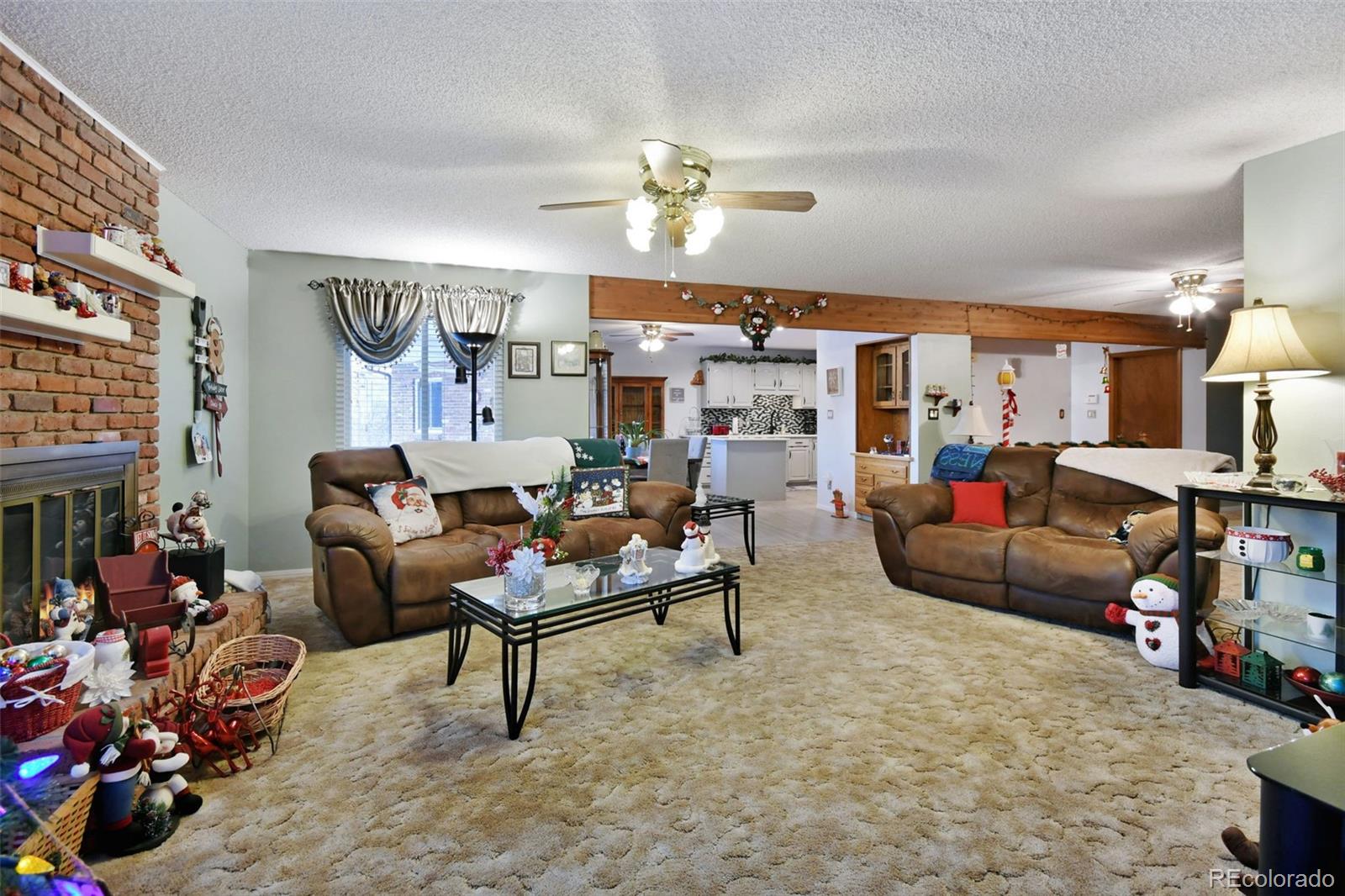 1360 Yank Street Golden, CO 80401 - Photo 16 of 26 a living room with furniture and a chandelier