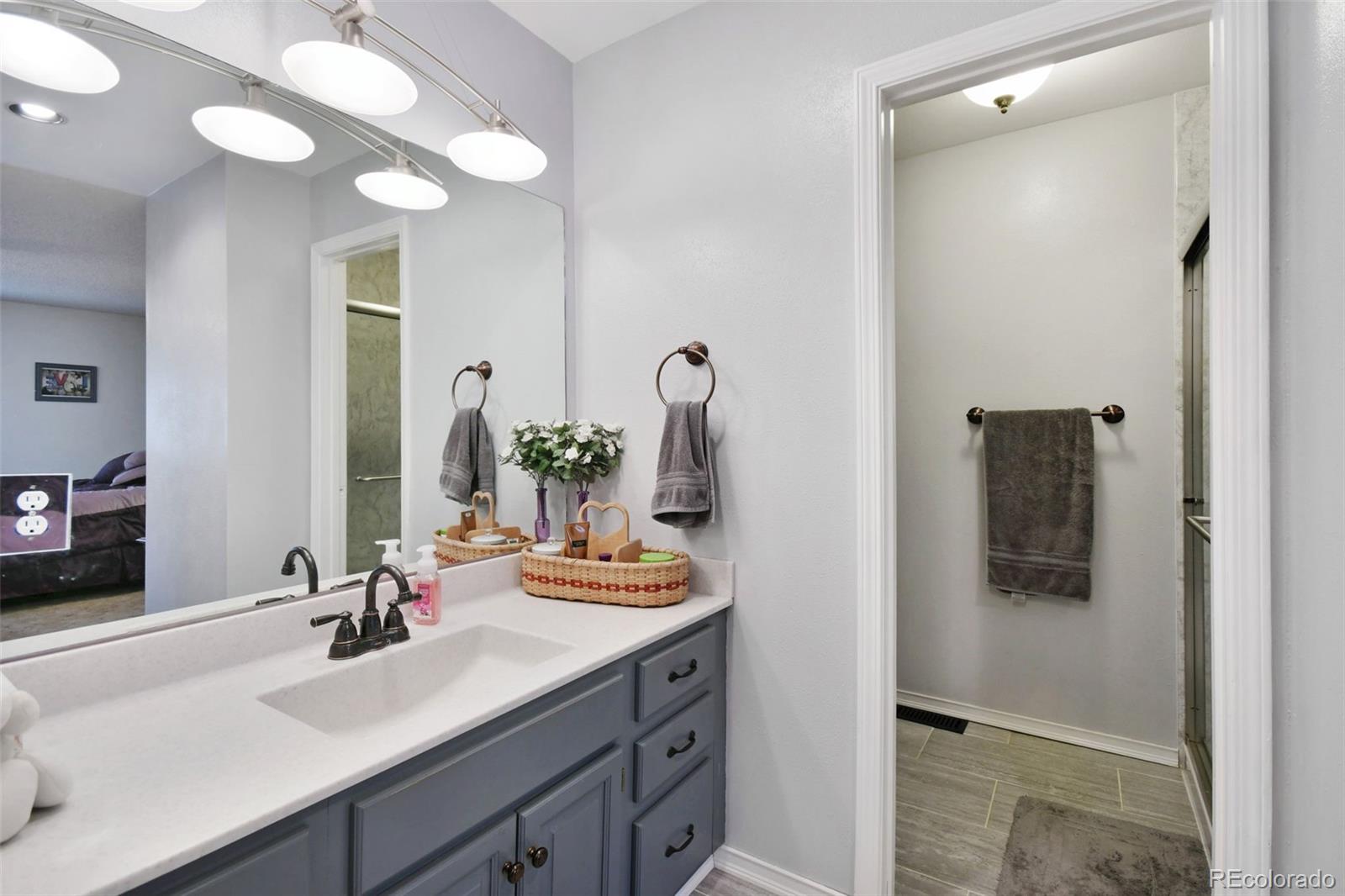 1360 Yank Street Golden, CO 80401 - Photo 19 of 26 a bathroom with a sink and a mirror