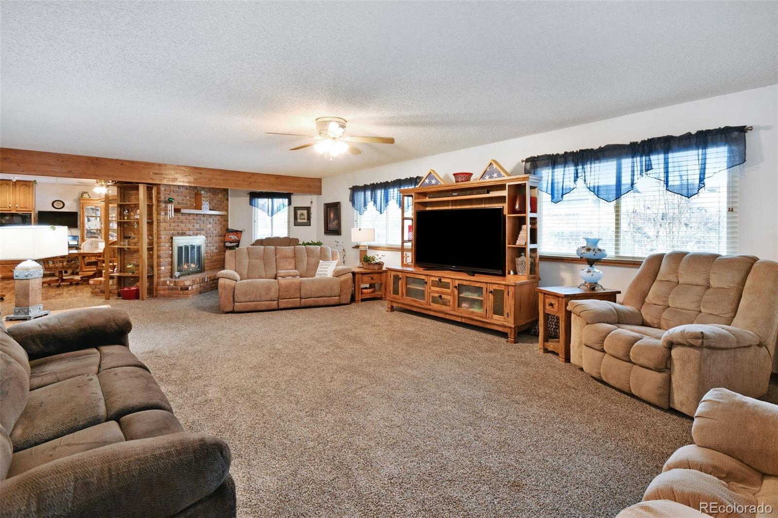 1360 Yank Street Golden, CO 80401 - Photo 2 of 26 a living room with furniture and a flat screen tv