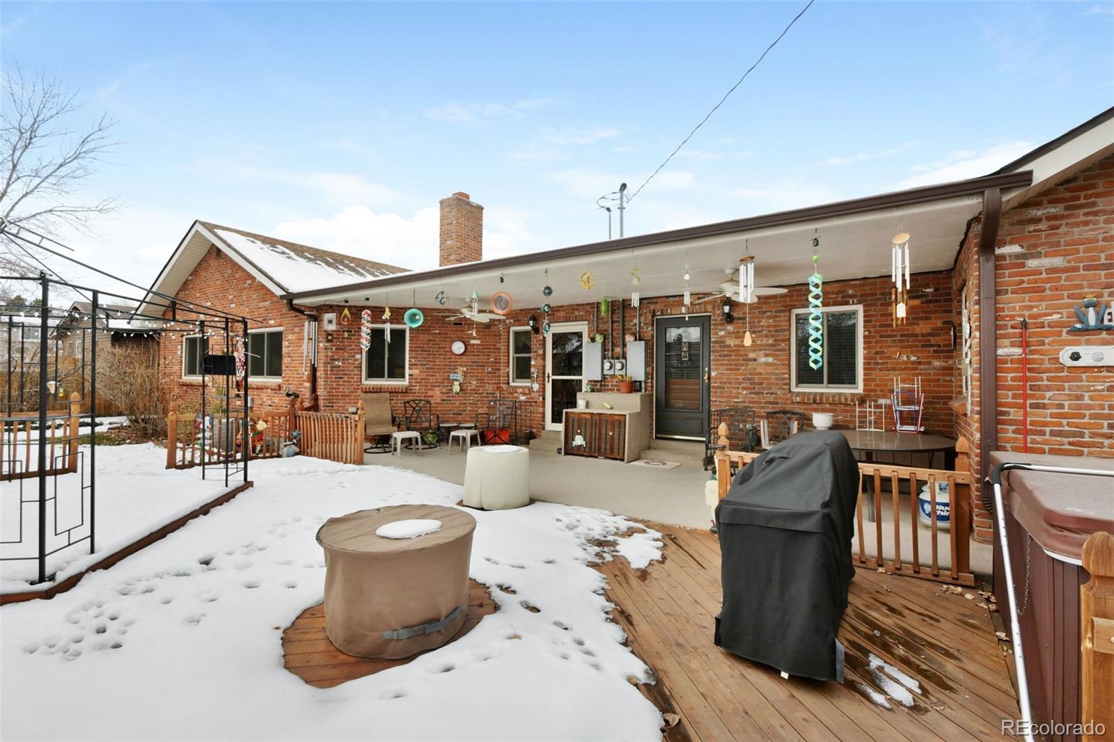 1360 Yank Street Golden, CO 80401 - Photo 26 of 26 a view of a patio with dining table and chairs