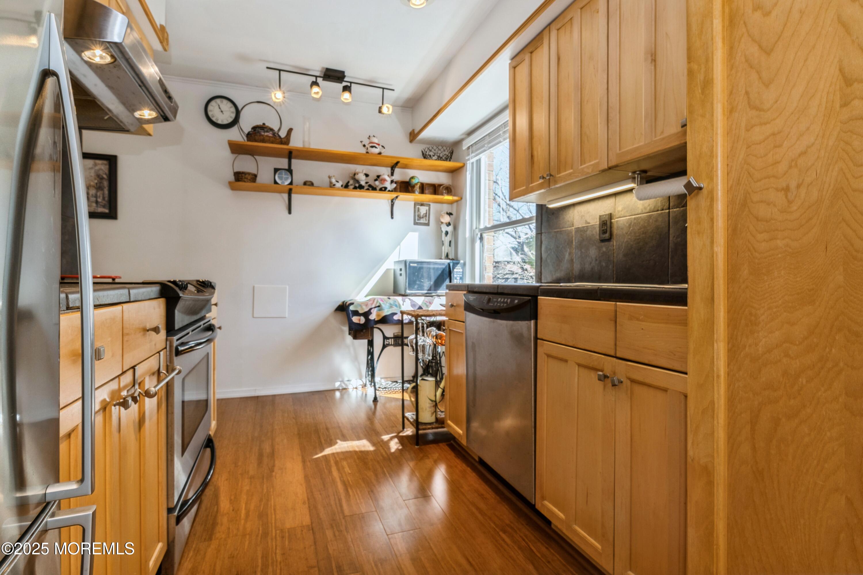 200 Portland Road, Unit 3D Highlands, NJ 07732 - Photo 8 of 15 a view of a kitchen with wooden floor