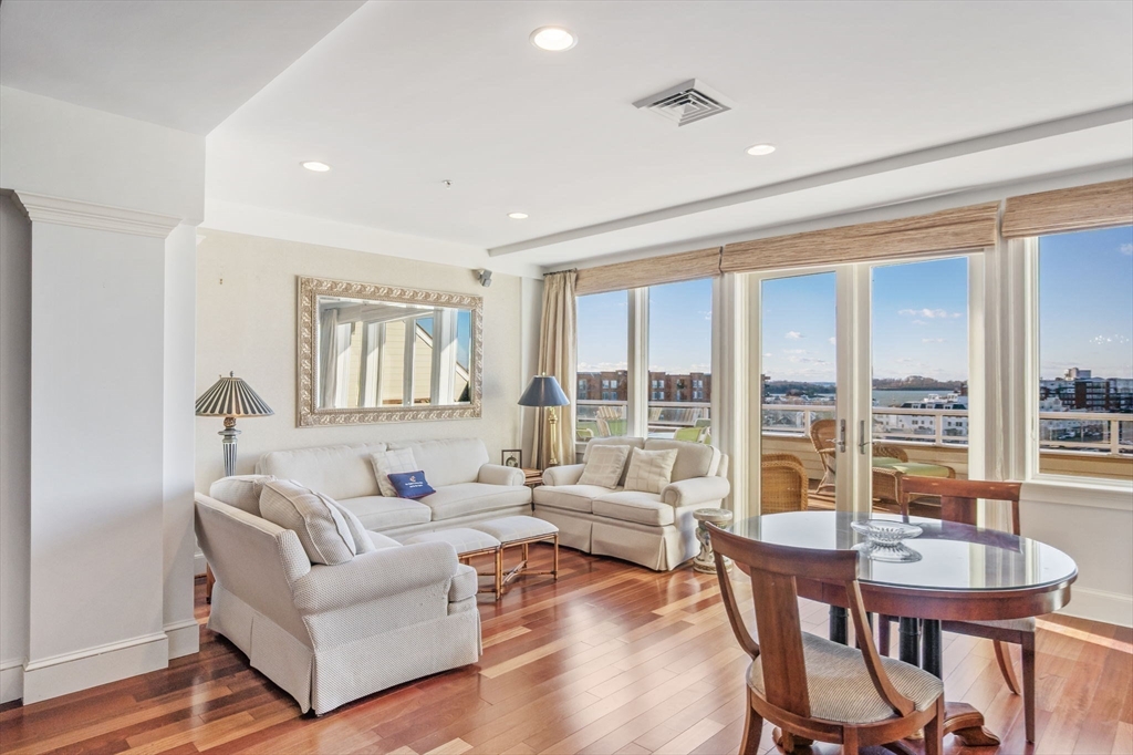 1 Longbeach Avenue, Unit 202 Hull, MA 02045 - Photo 16 of 40 a living room with furniture and a large window
