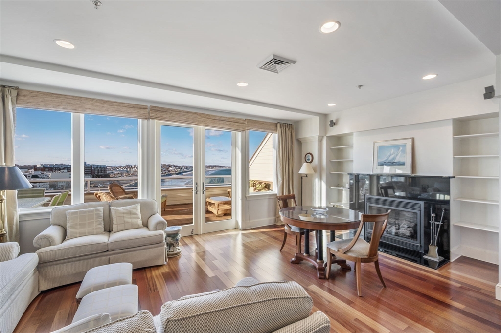 1 Longbeach Avenue, Unit 202 Hull, MA 02045 - Photo 17 of 40 a living room with furniture and a table