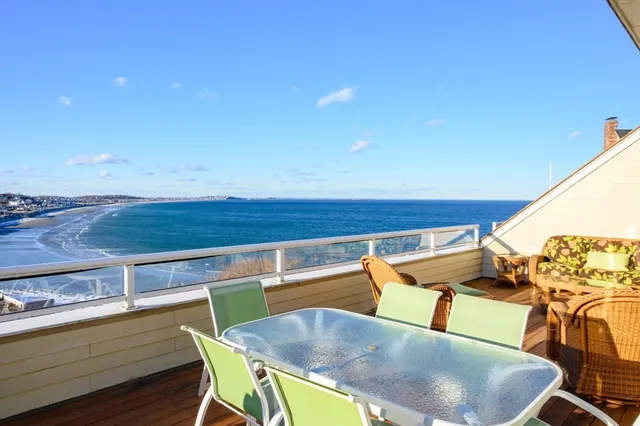 a view of a chairs and table in the patio