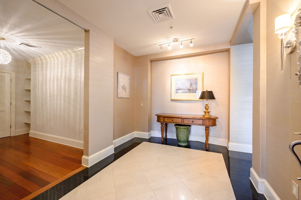 1 Longbeach Avenue, Unit 202 Hull, MA 02045 - Photo 4 of 40 a very nice looking room with a large mirror