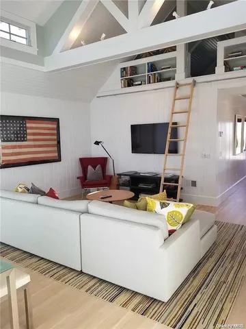 a room with furniture and flat screen tv