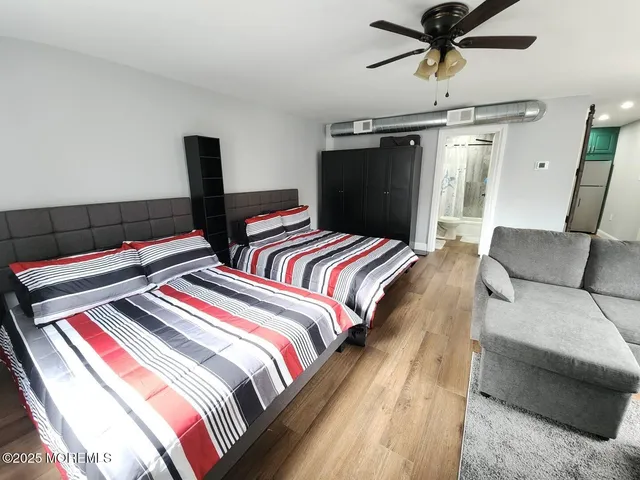 a bedroom with bed and a window