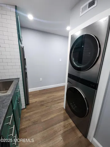 a view of a hallway with washer and dryer