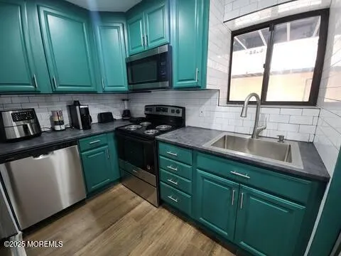 a kitchen with cabinets a window and a sink