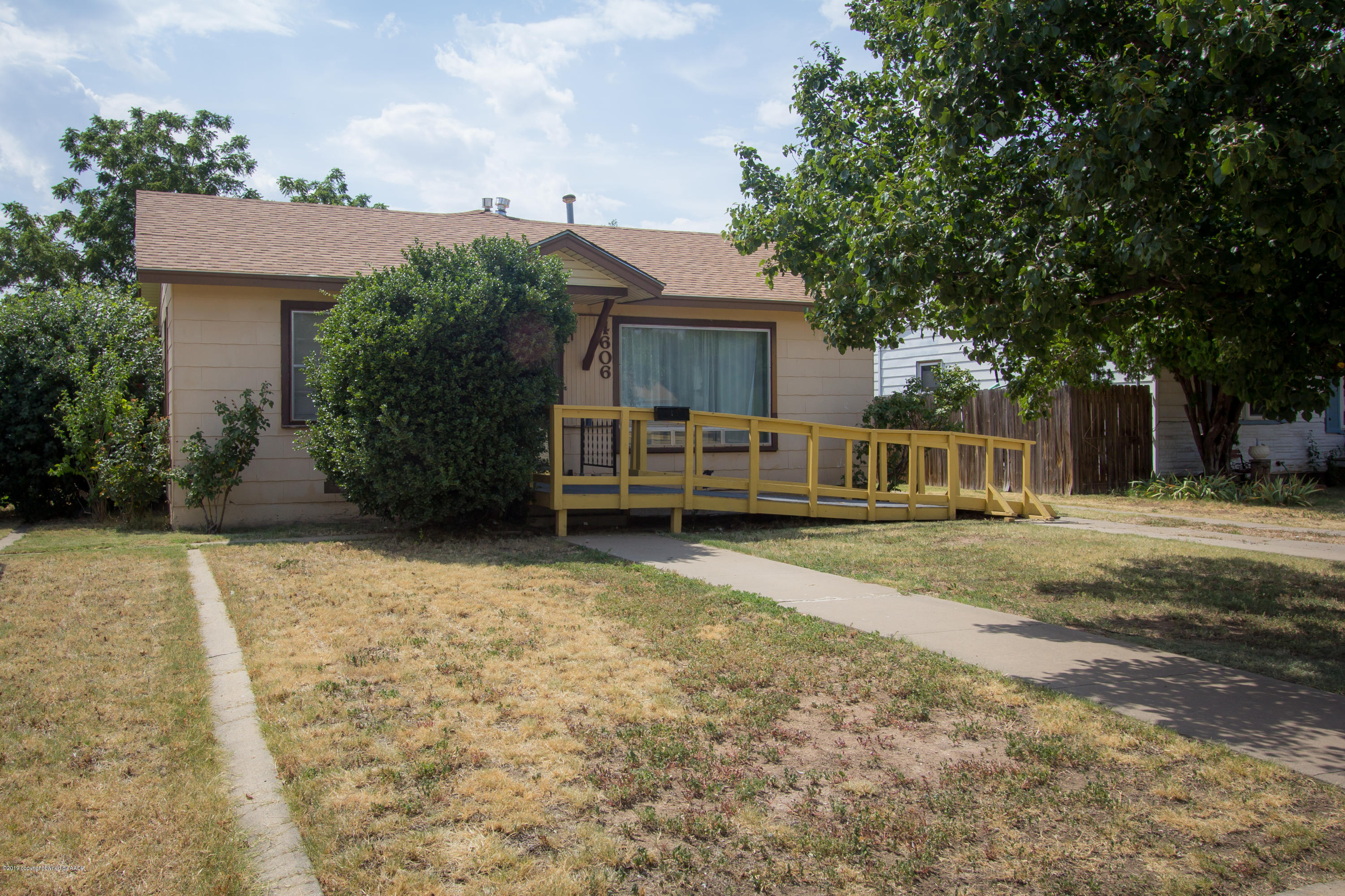 4606 Bowie Street Amarillo, TX 79110 - Photo 1 of 42 a front view of a house with a yard