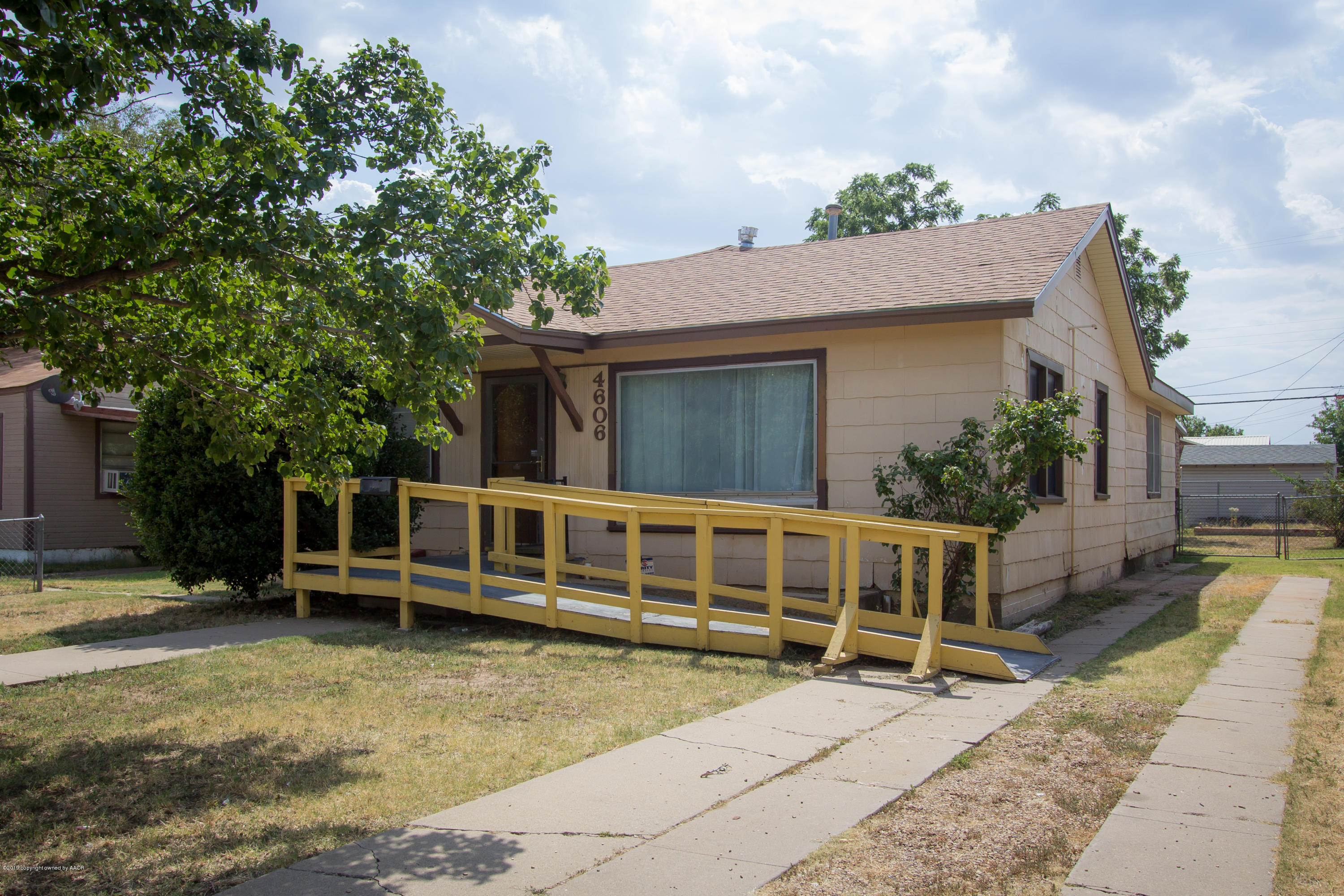 4606 Bowie Street Amarillo, TX 79110 - Photo 2 of 42 a view of a house with a yard