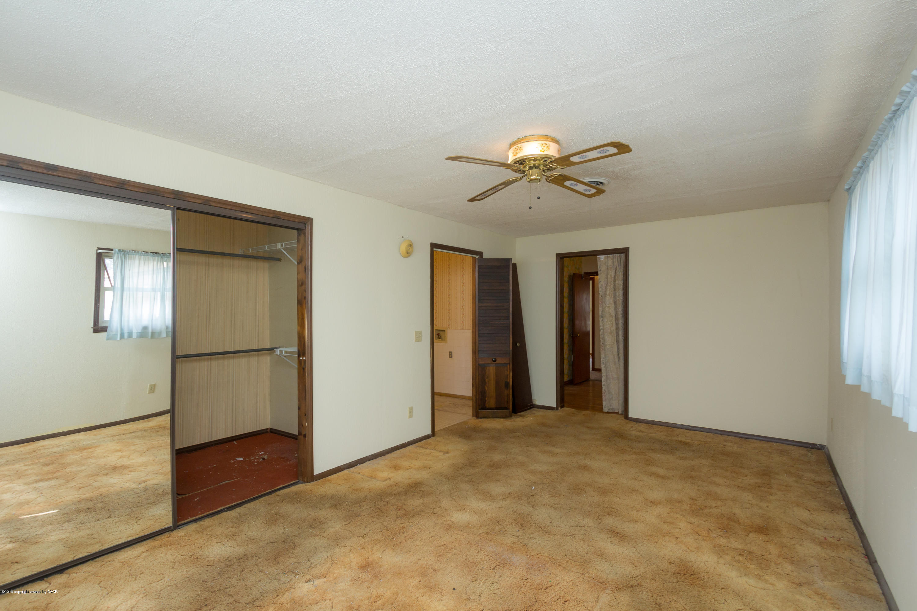 4606 Bowie Street Amarillo, TX 79110 - Photo 14 of 42 a view of an empty room with a window