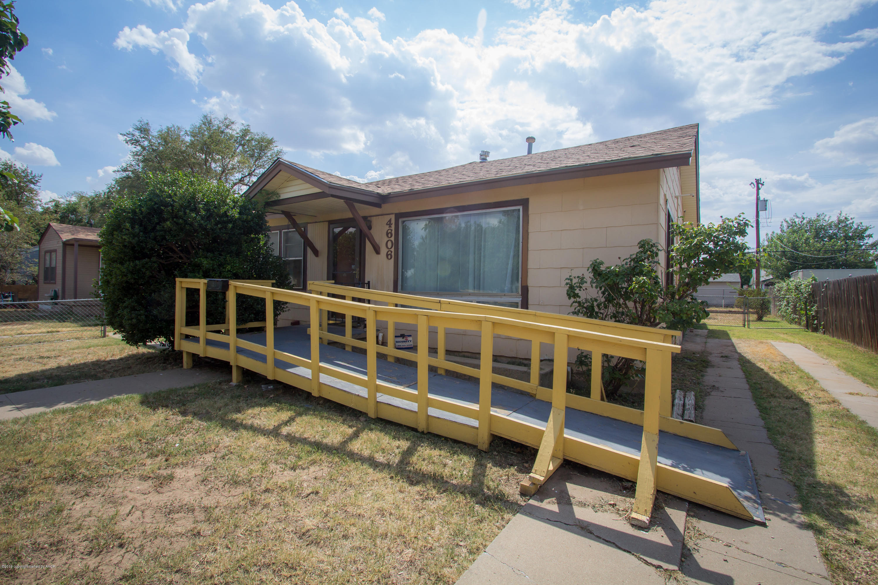 4606 Bowie Street Amarillo, TX 79110 - Photo 3 of 42 a view of a house with a yard and sitting area