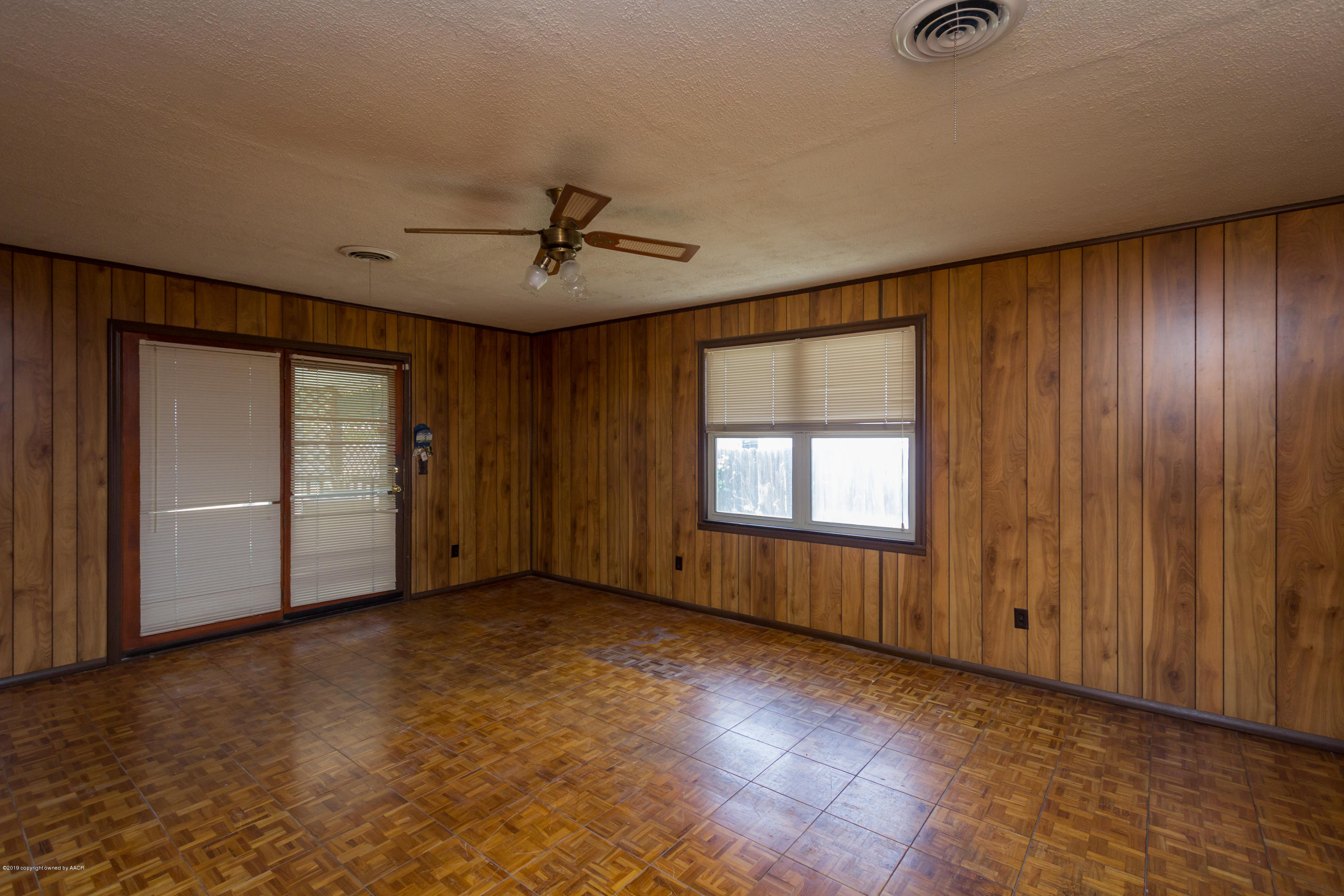 4606 Bowie Street Amarillo, TX 79110 - Photo 21 of 42 a view of an empty room with a window