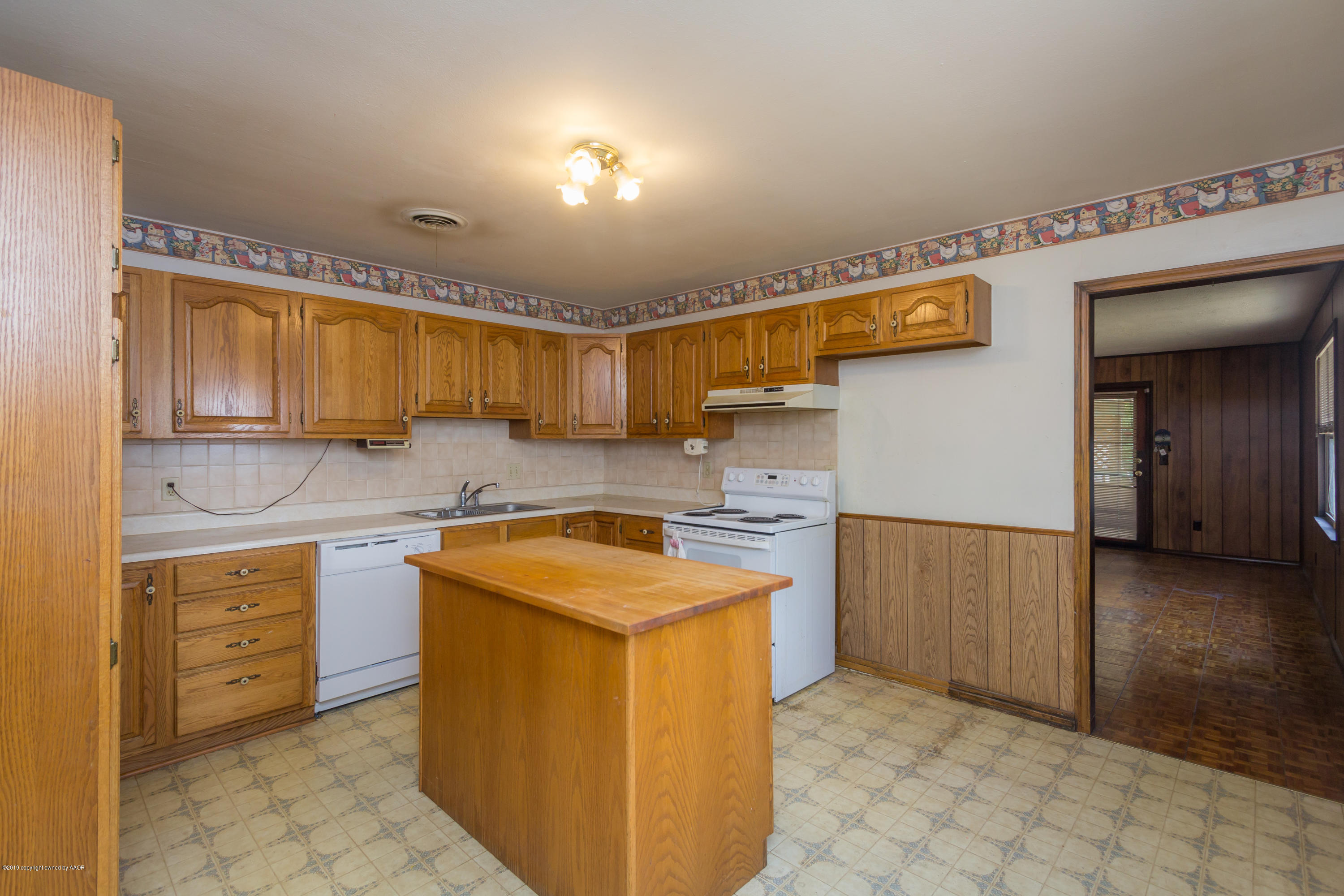 4606 Bowie Street Amarillo, TX 79110 - Photo 22 of 42 a utility room with cabinets washer and dryer