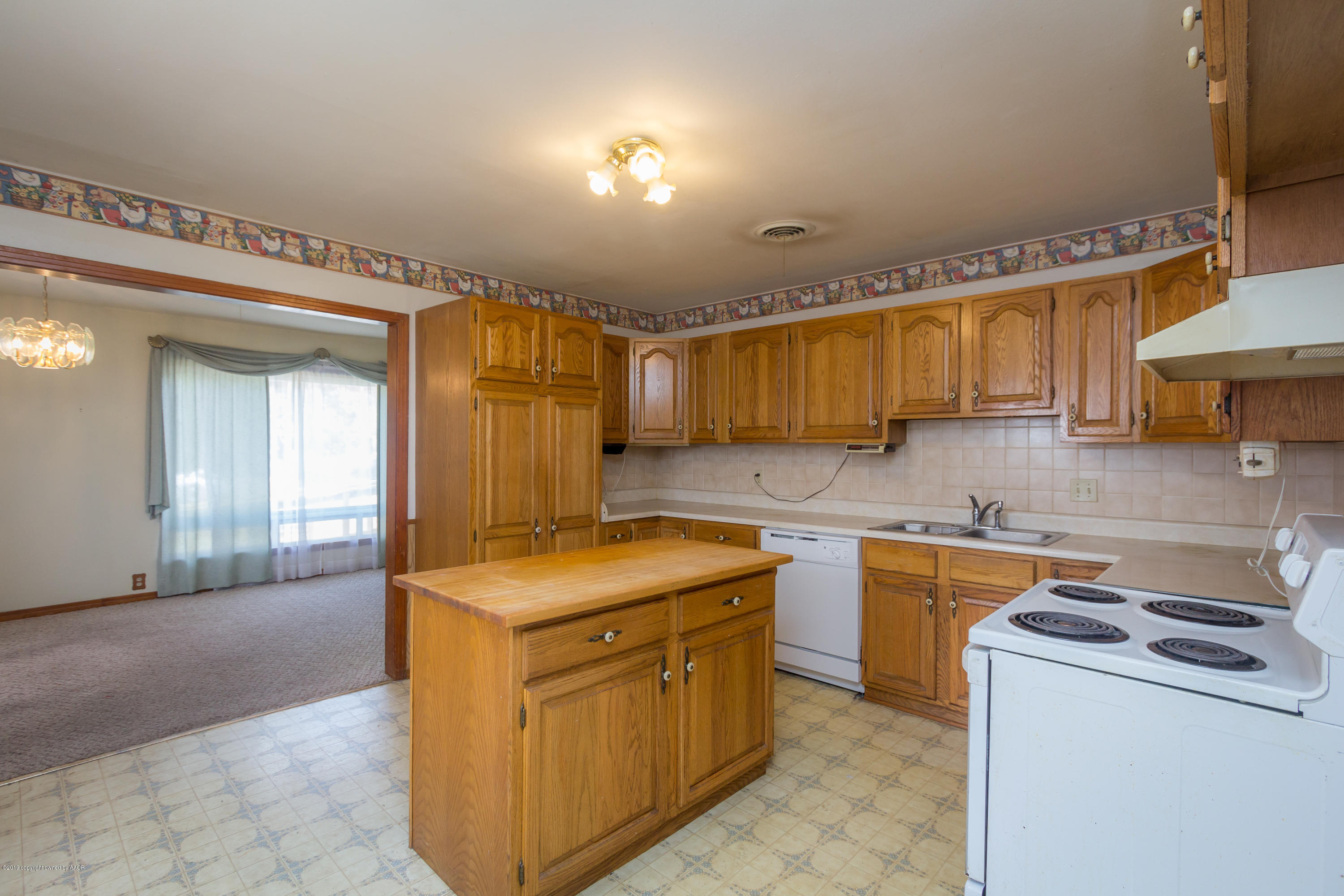 4606 Bowie Street Amarillo, TX 79110 - Photo 26 of 42 a utility room with cabinets washer and dryer