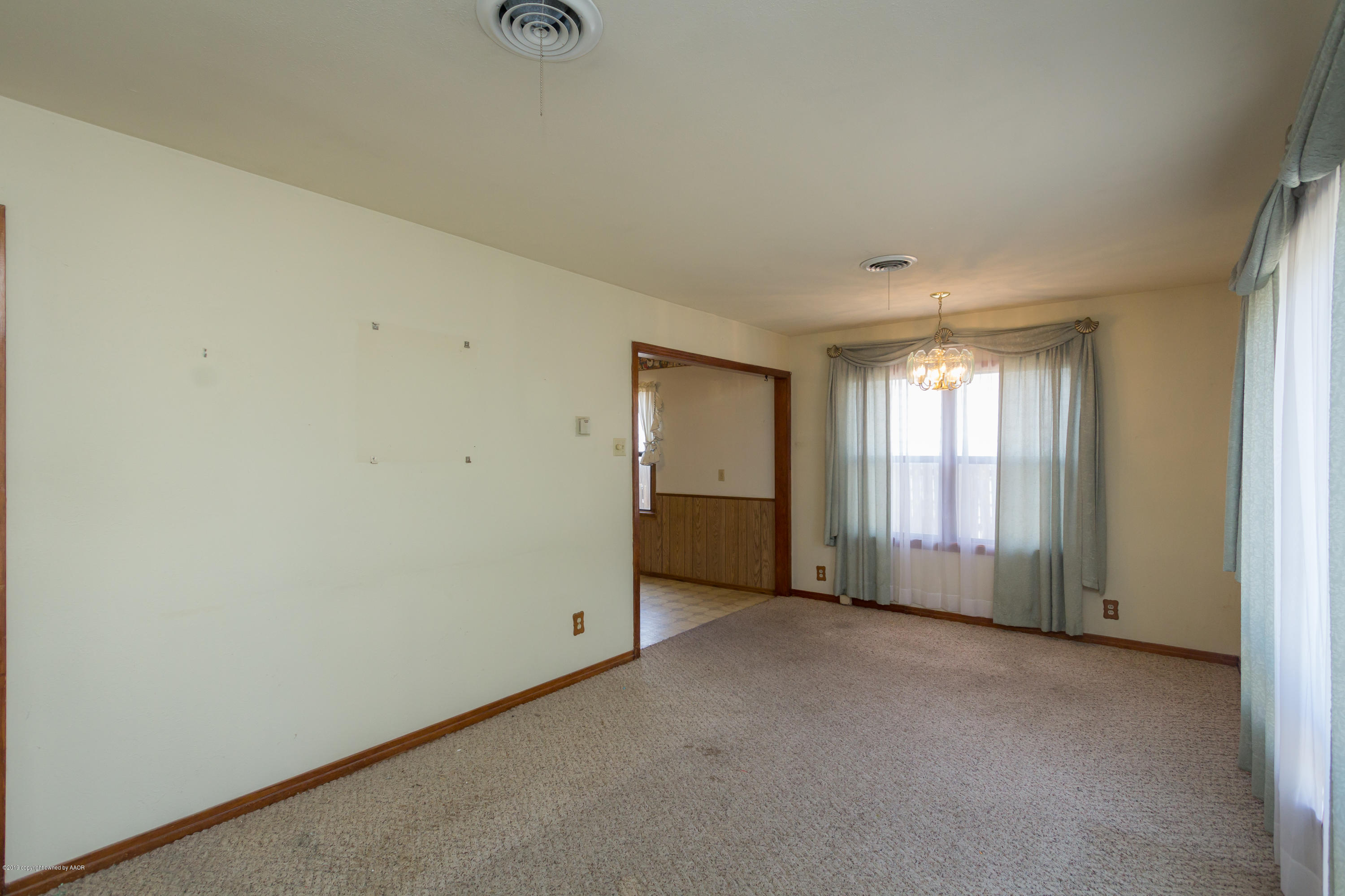 4606 Bowie Street Amarillo, TX 79110 - Photo 31 of 42 an empty room with windows