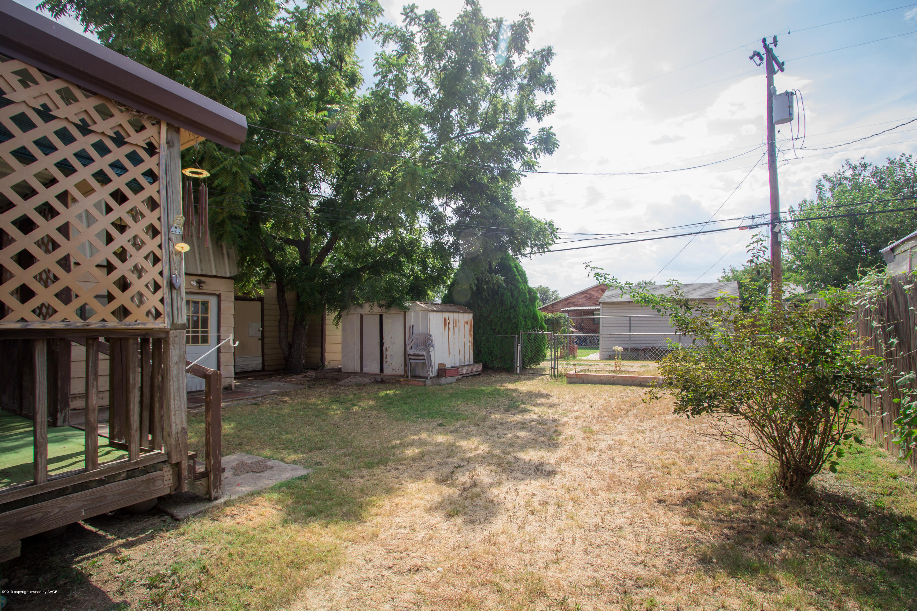 4606 Bowie Street Amarillo, TX 79110 - Photo 36 of 42 a view of a backyard with wooden fence